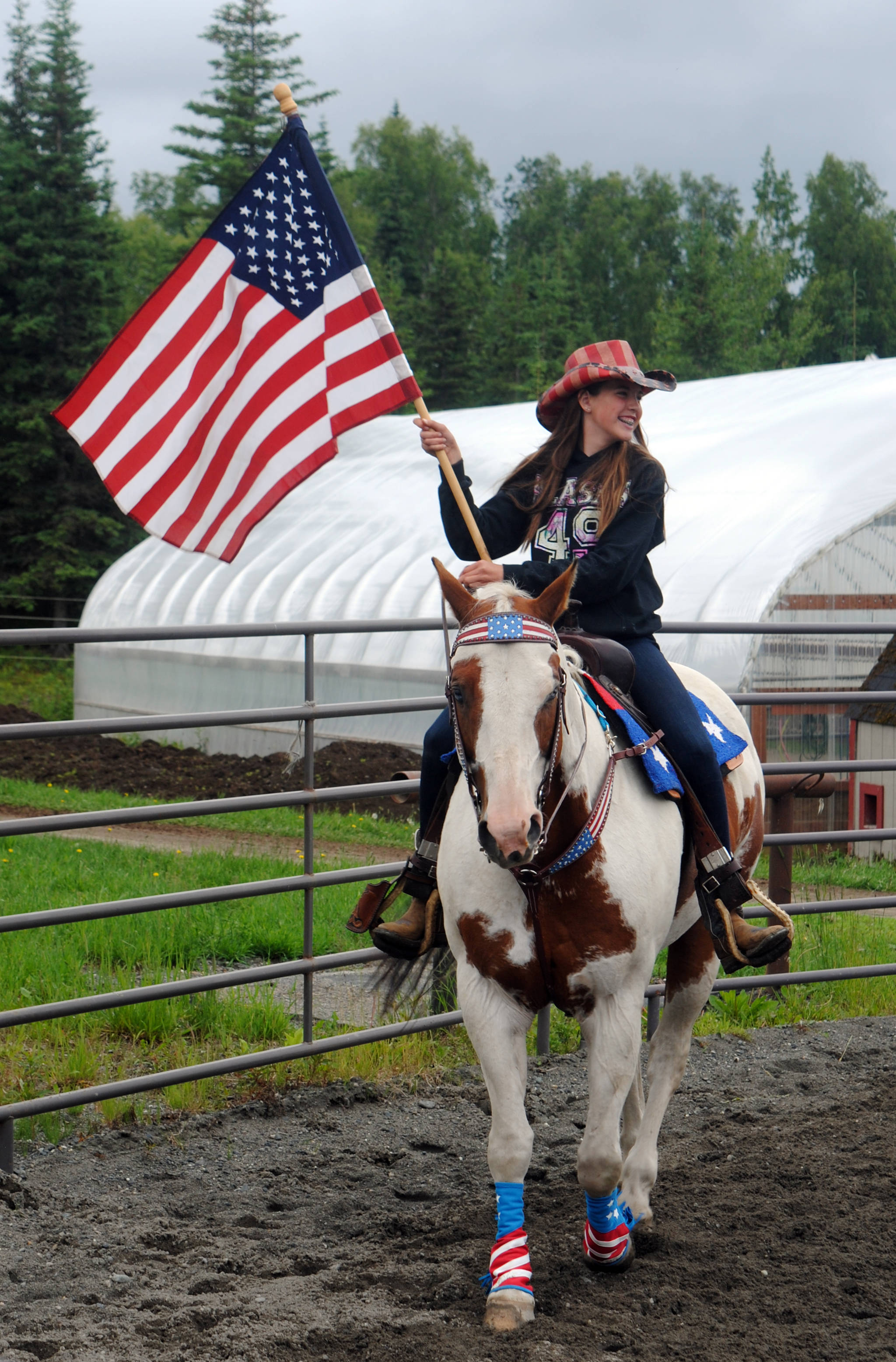 Madelyn Barkman practices horseback riding at Alaska C&C Horse Adventures in Soldotna on Monday in preparation for the Kenai Fourth of July Parade, which begins today at 11 a.m. (Photo by Kat Sorensen/Peninsula Clarion)