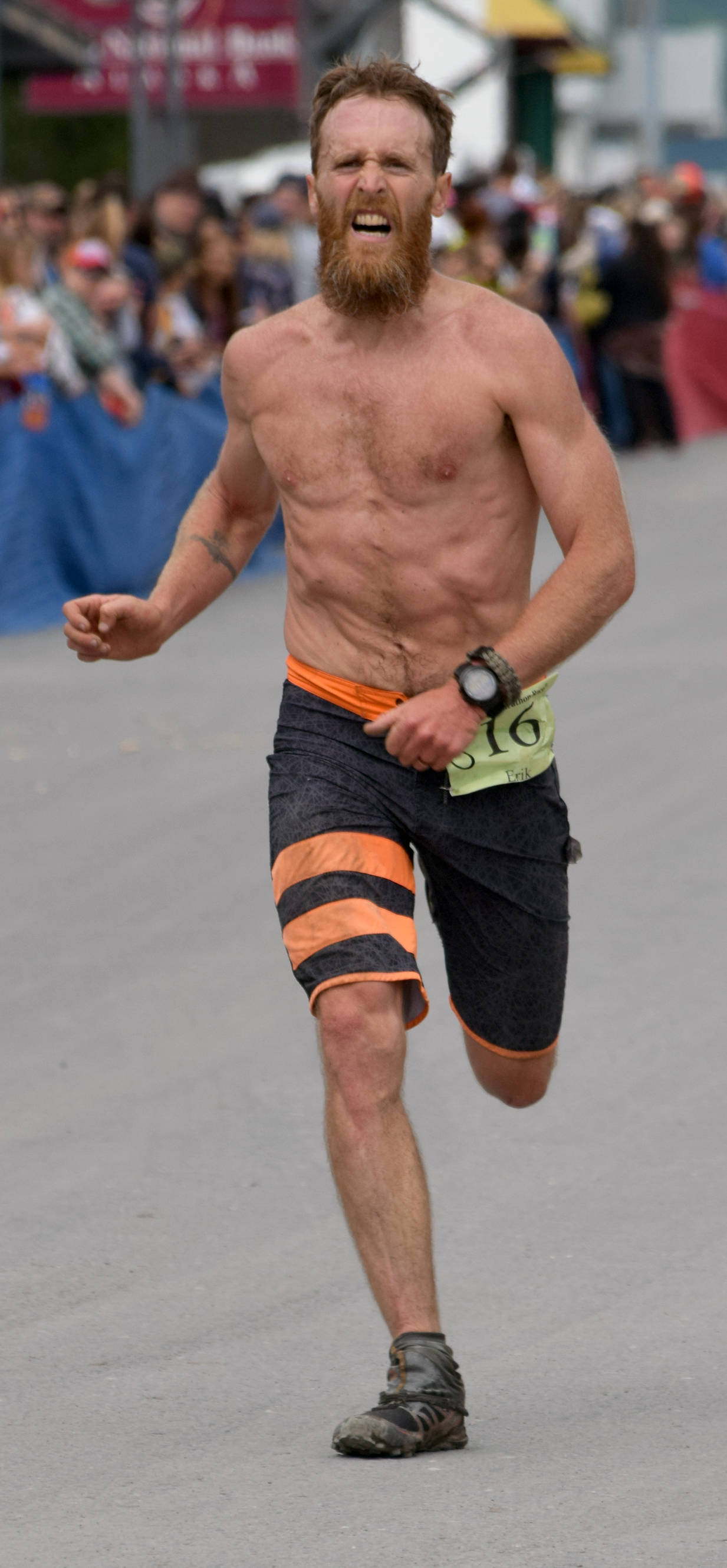 Seward’s Erik Johnson finishes off a runner-up finish in the men’s race at Mount Marathon in Seward on Tuesday, July 4, 2017. (Photo by Jeff Helminiak/Peninsula Clarion)