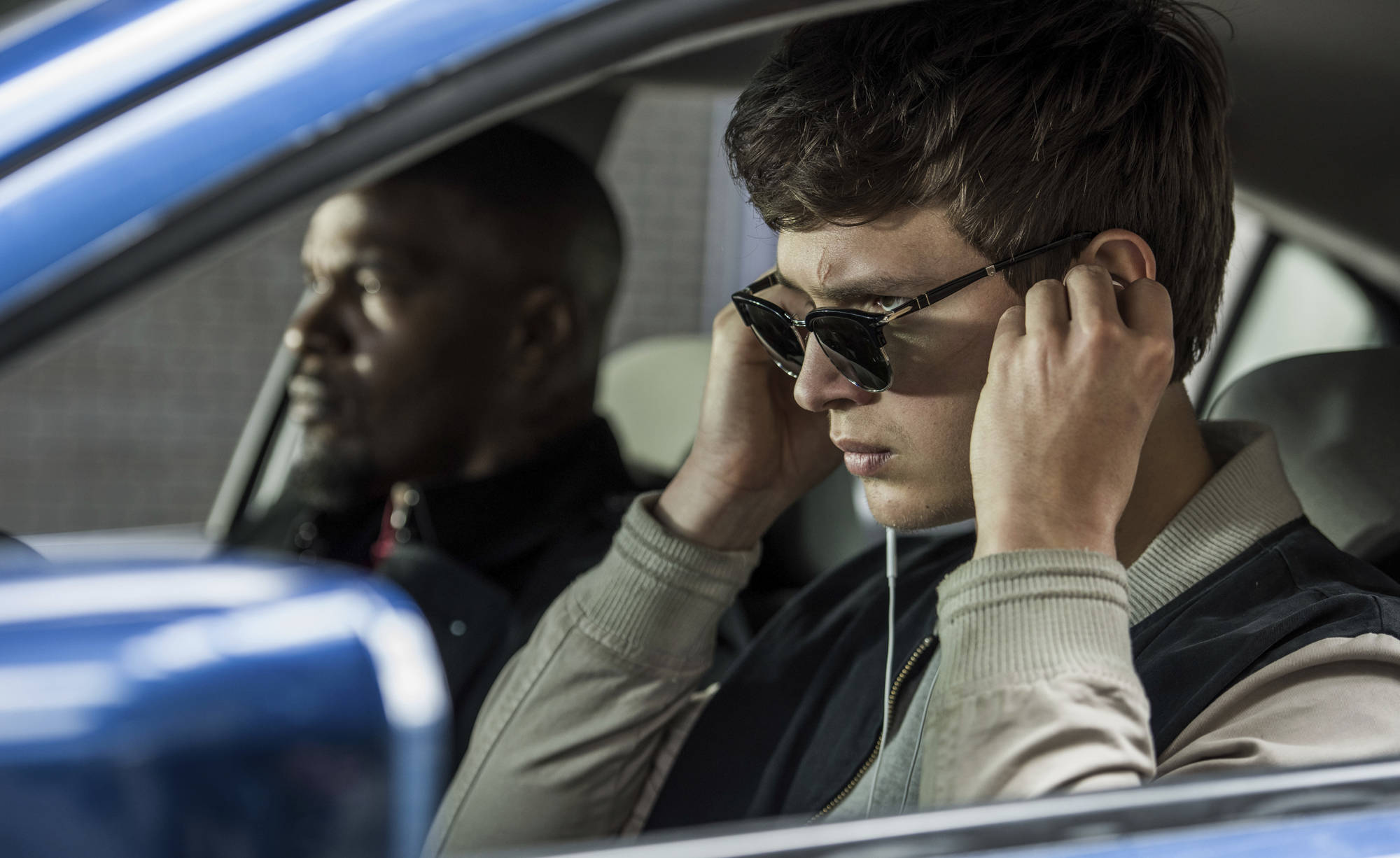 This image released by Sony Pictures shows Ansel Elgort, right, and Jamie Foxx in a scene from “Baby Driver.” (Wilson Webb/Sony/TriStar Pictures via AP)