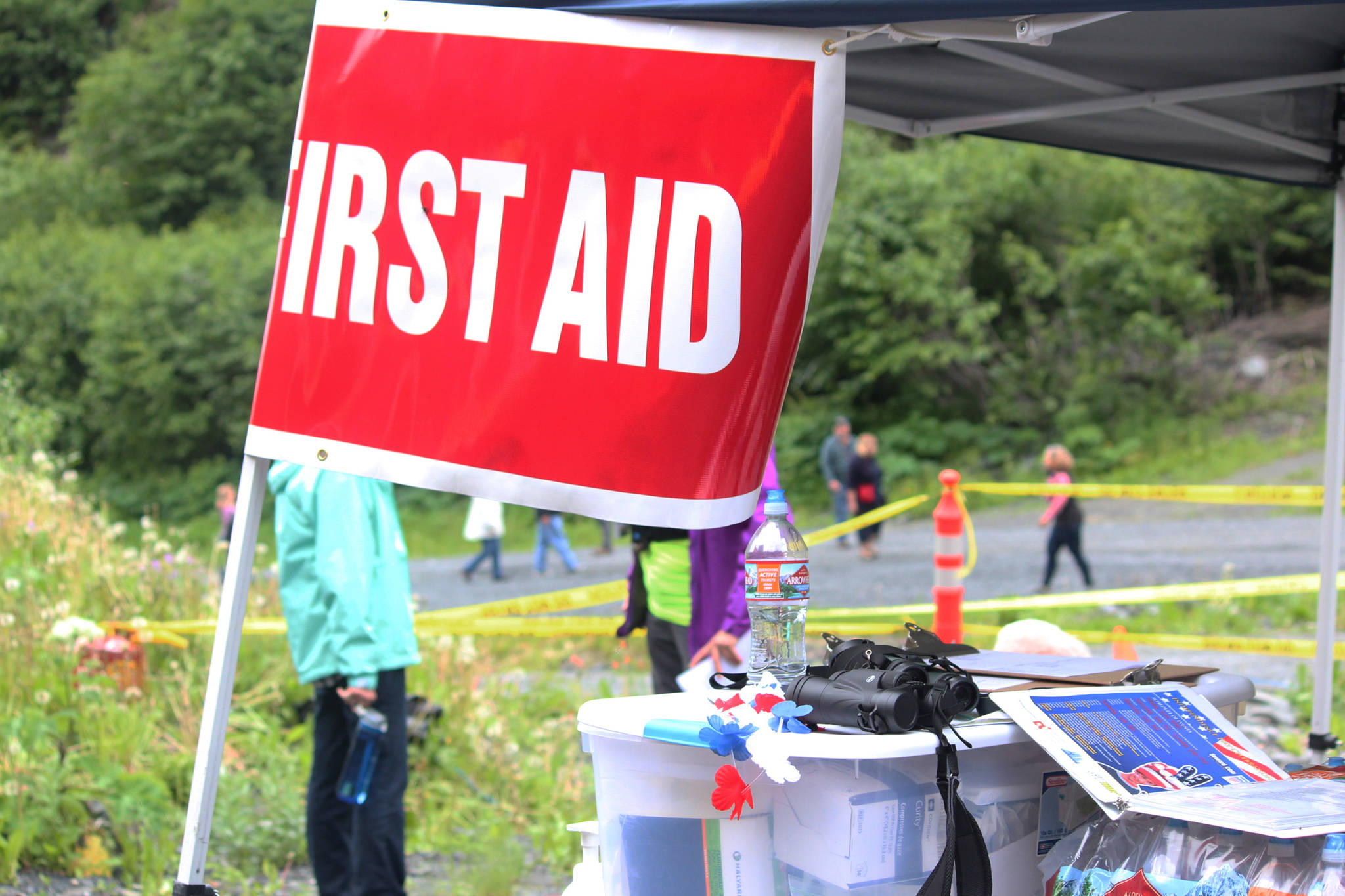 Supplies and some Fourth of July accessories sit ready and waiting in a first aid tent at the base of Mount Marathon during the annual Mount Marathon Race on Tuesday, July 4, 2017 in Seward, Alaska. For the last four years, there has been a more official effort to provide first aid to runners on the mountain and at its base. (Photo by Megan Pacer/Peninsula Clarion)