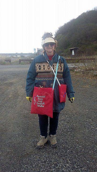 June Searcy-Josten, of Happy Valley, gears up for a day of beachcombing in the cold wind with a large bag for driftwood and smaller bags for miscellaneous shells and rocks. (Photo courtesy/June Searcy-Josten)