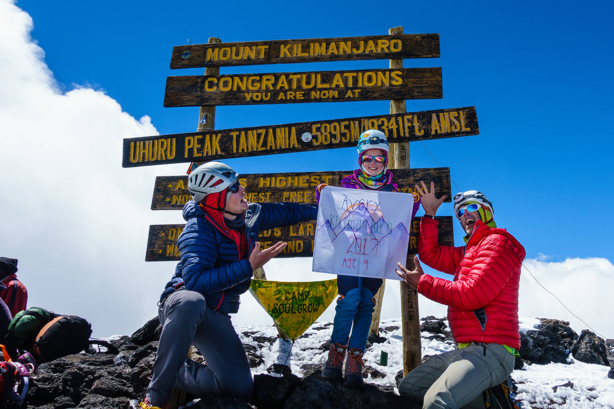 Avery Walden, then 9, poses at the peak of Mt. Kilimanjaro in Tanzania with her father Chris Walden (right) and a family friend on Jan. 6, 2017. The group climbed the famous mountain in January, making Avery the youngest female to ascend the mountain. (Photo courtesy Chris Walden)