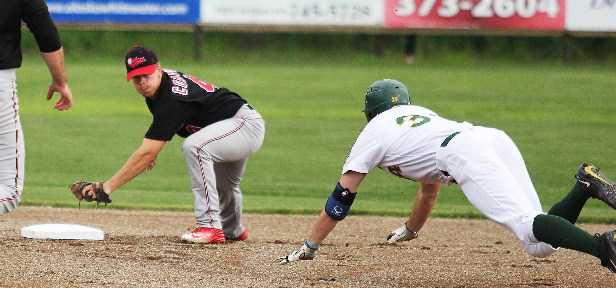 Peninsula Oilers infielder Josh Congdon gets ready to make the tag as Mat-Su’s Blake Benefield slides toward second base during a 2-1 win over the Miners Friday at Hermon Brothers Field in Palmer. (Photo by Jeremiah Bartz/Frontiersman)