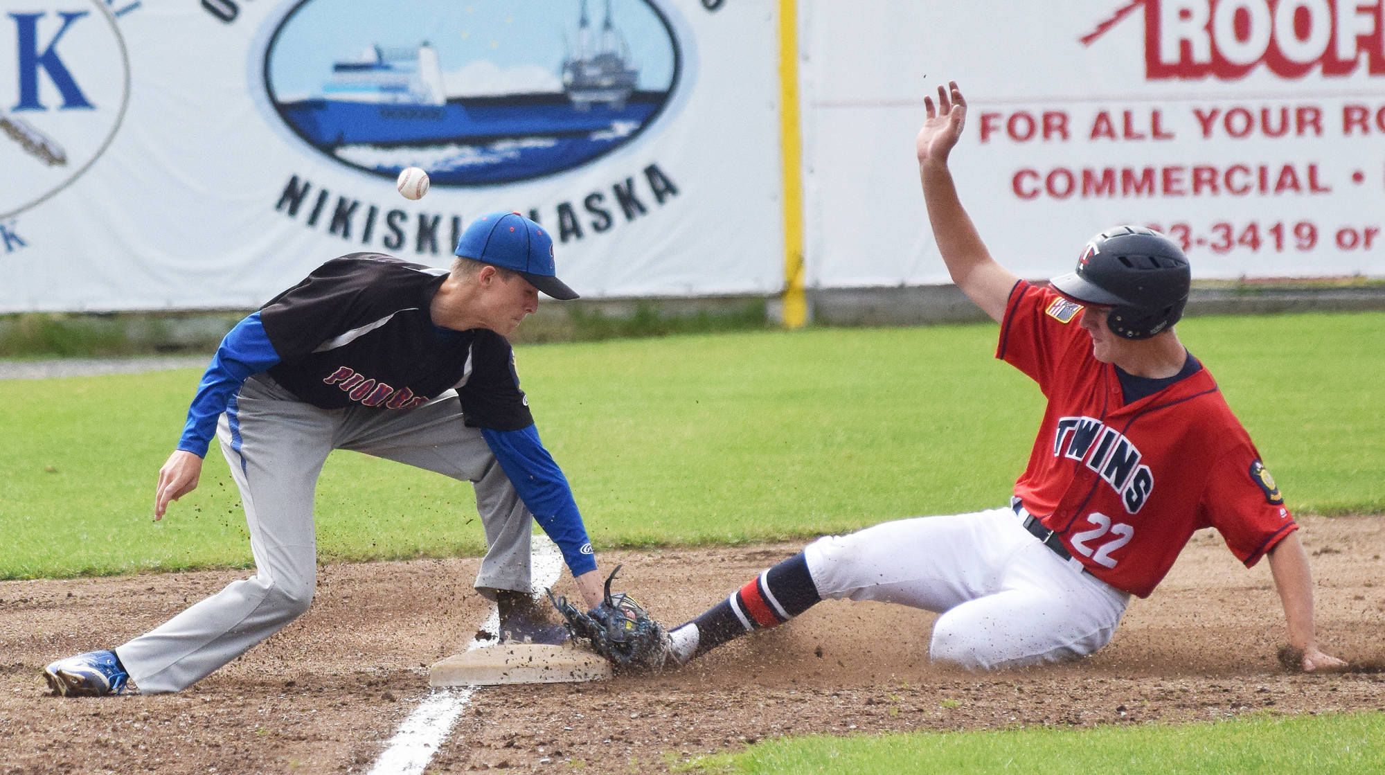 The Post 20 Twins’ Cody Quelland slides into third base ahead of the botched tag by Palmer’s Alasada McKechnie, Sunday at Coral Seymour Memorial Ballpark in Kenai. (Photo by Joey Klecka/Peninsula Clarion)