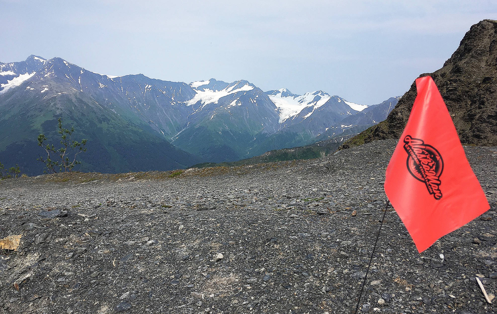 An Alaskaman course flag marks the route for the Inaugural Alaskamn Extreme Triathlon on Mount Alyeska in Girdwood. (Photo by Jeff Helminiak/Peninsula Clarion)