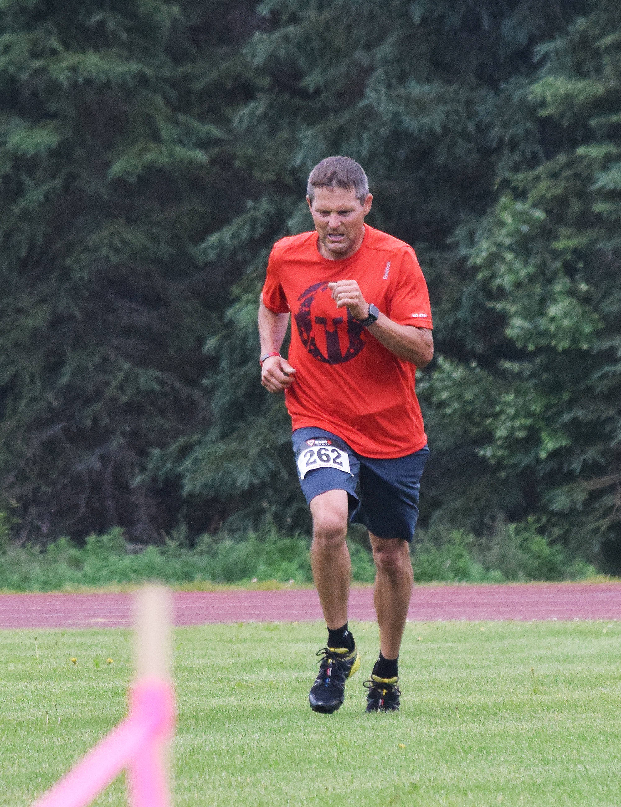 Ten-kilometer race winner Bill Wood approaches the finish line Saturday at the Rotary Unity Run at Tsalteshi Trails.