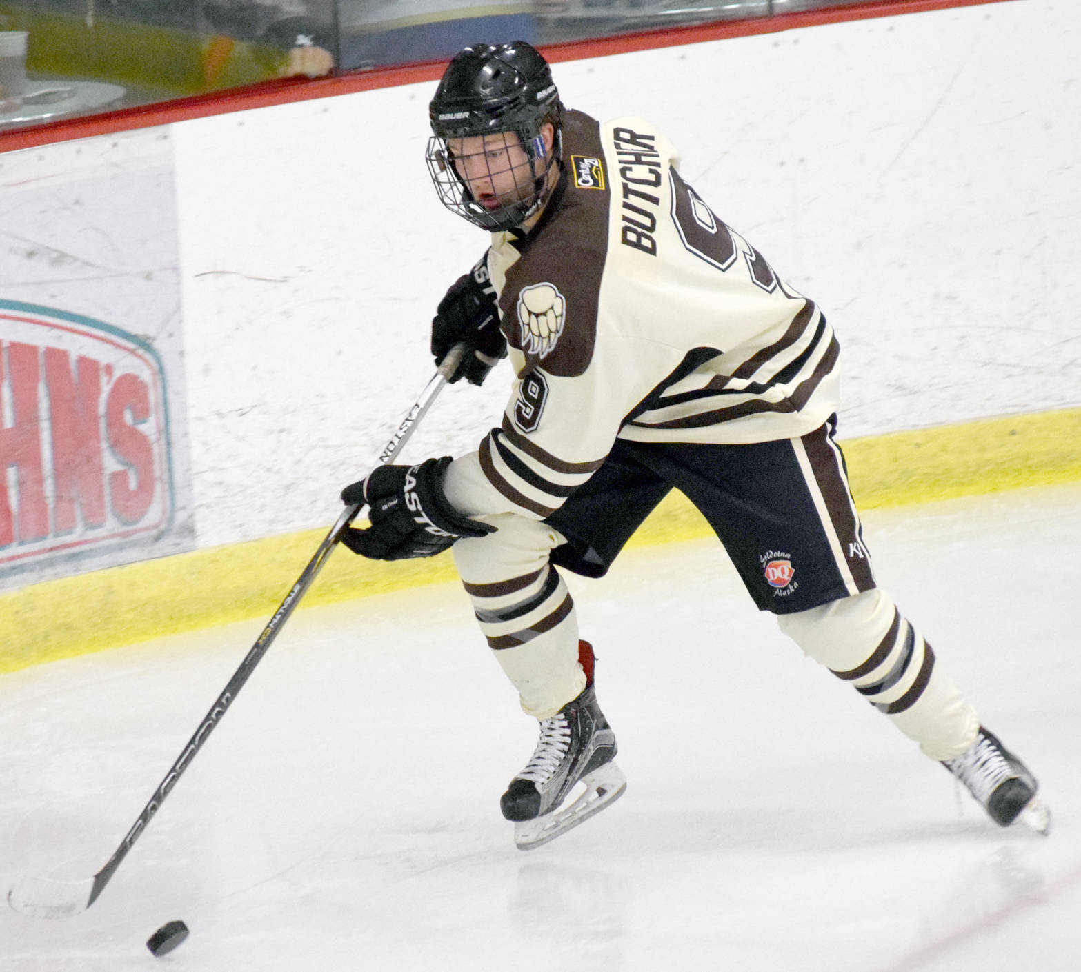 Evan Butcher moves the puck at the Soldotna Regional Sports Complex last season. (Photo by Jeff Helminiak/Peninsula Clarion)