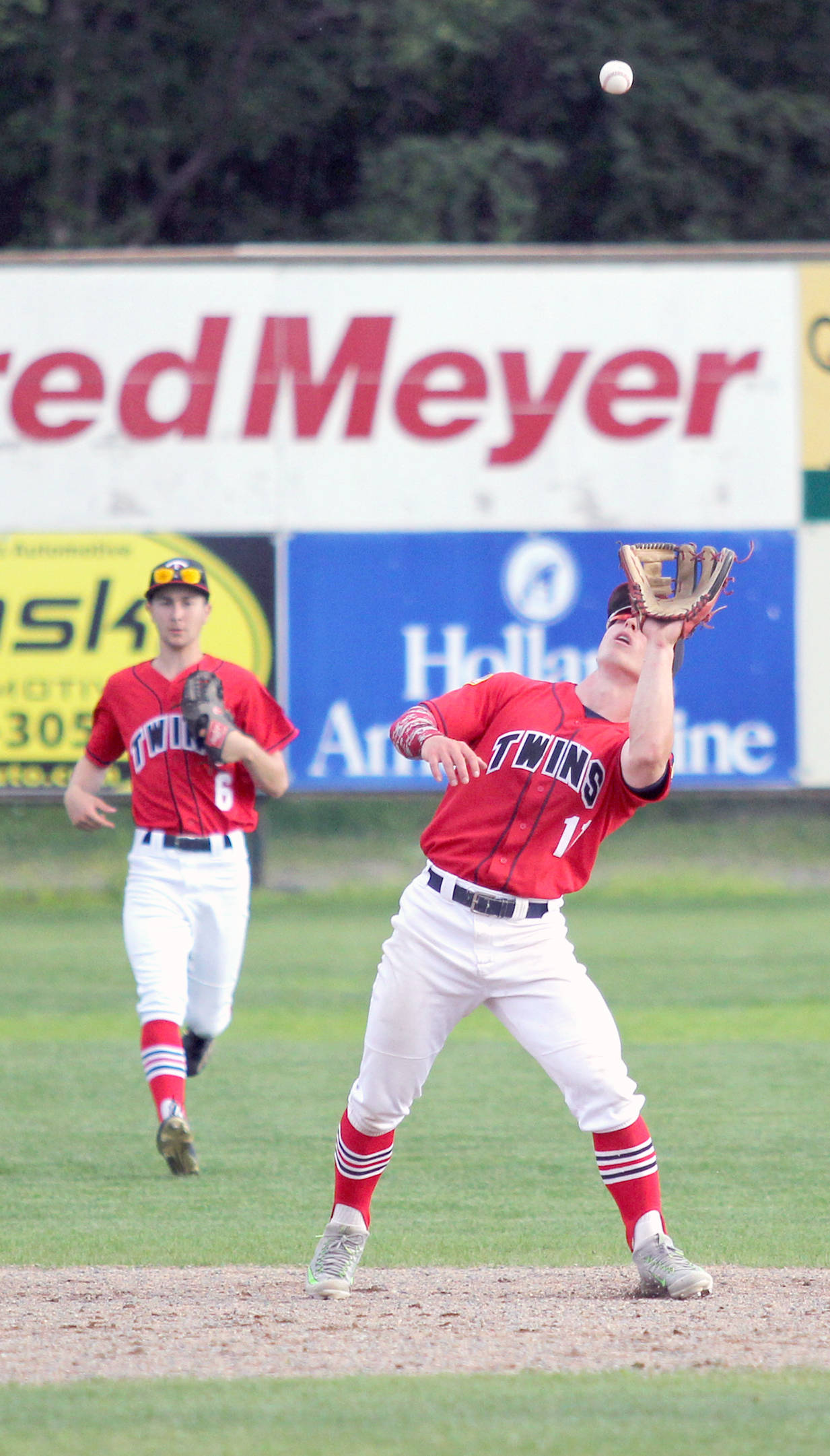 Kenai infielder Paul Steffensen catches a pop fly during an 11-3 win over the Palmer Pioneers on Friday, July 21, 2017, at Hermon Brothers Field in Palmer. (Photo by Jeremiah Bartz/Frontiersman)