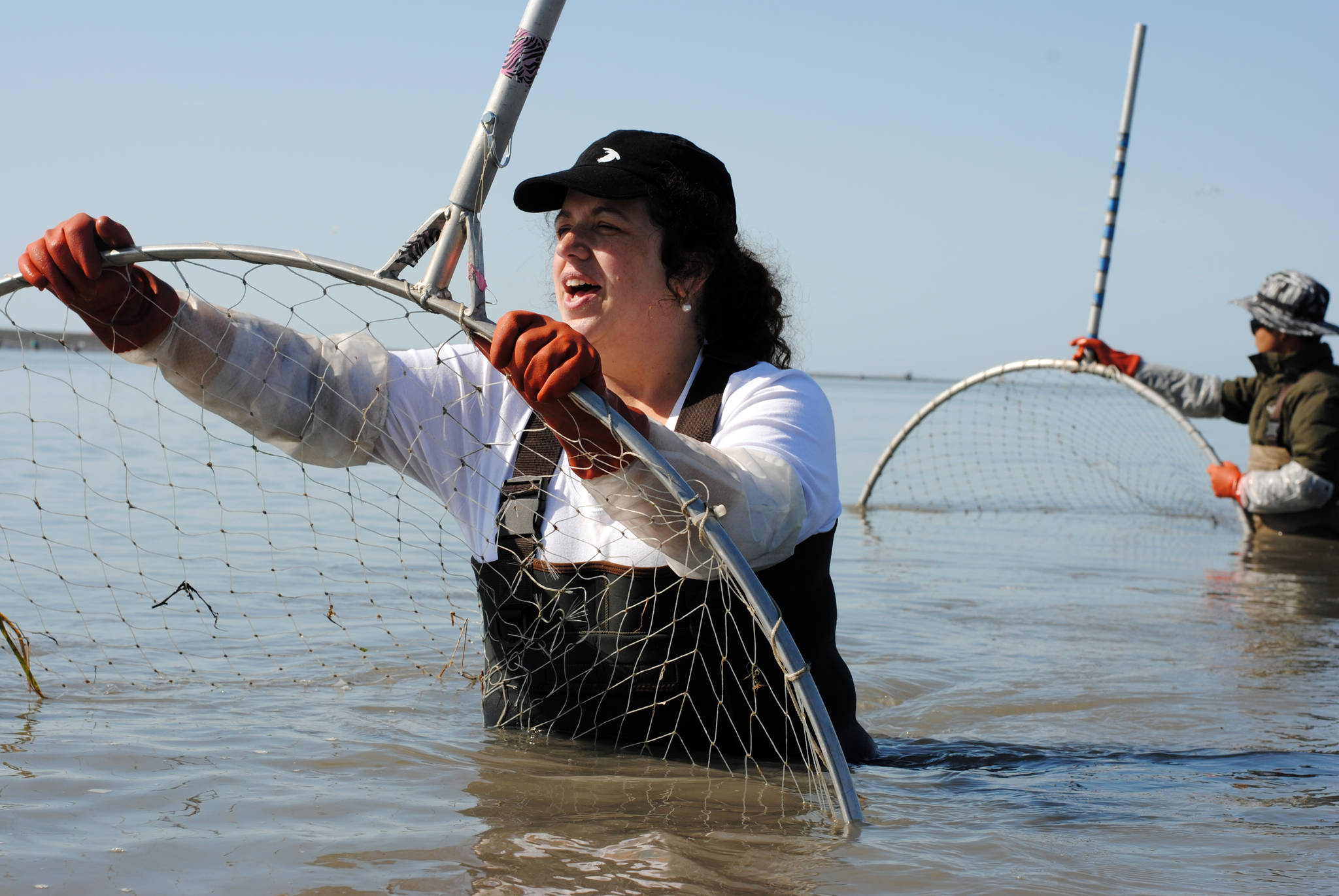 Annie Cromwell of Anchorage dipnets for sockeye salmon Sunday, July 23, on the north beach in Kenai, Alaska. (Photo by Kat Sorensen/Peninsula Clarion)