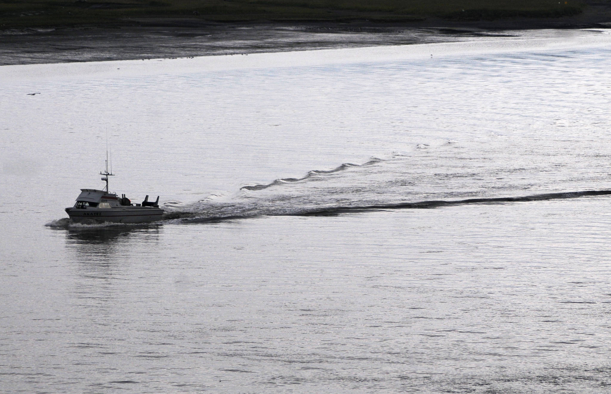 A drift gillnet fishing vessel makes its way into the Kenai River on Friday in Kenai. (Photo by Elizabeth Earl/Peninsula Clarion)