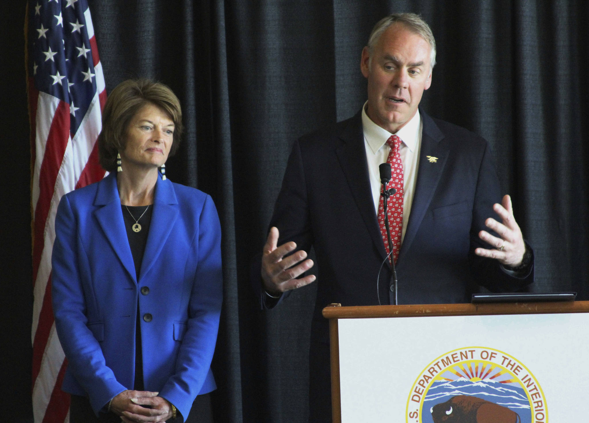 In this May 31 file photo, Interior Secretary Ryan Zinke, right, with Sen. Lisa Murkowski, R-Alaska, speaks during a news conference in Anchorage, Alaska. Zinke said it is “laughable” to suggest he threatened Alaska’s U.S. senators Murkowski and Dan Sullivan over a vote by one of them on health care. (AP Photo/Mark Thiessen)