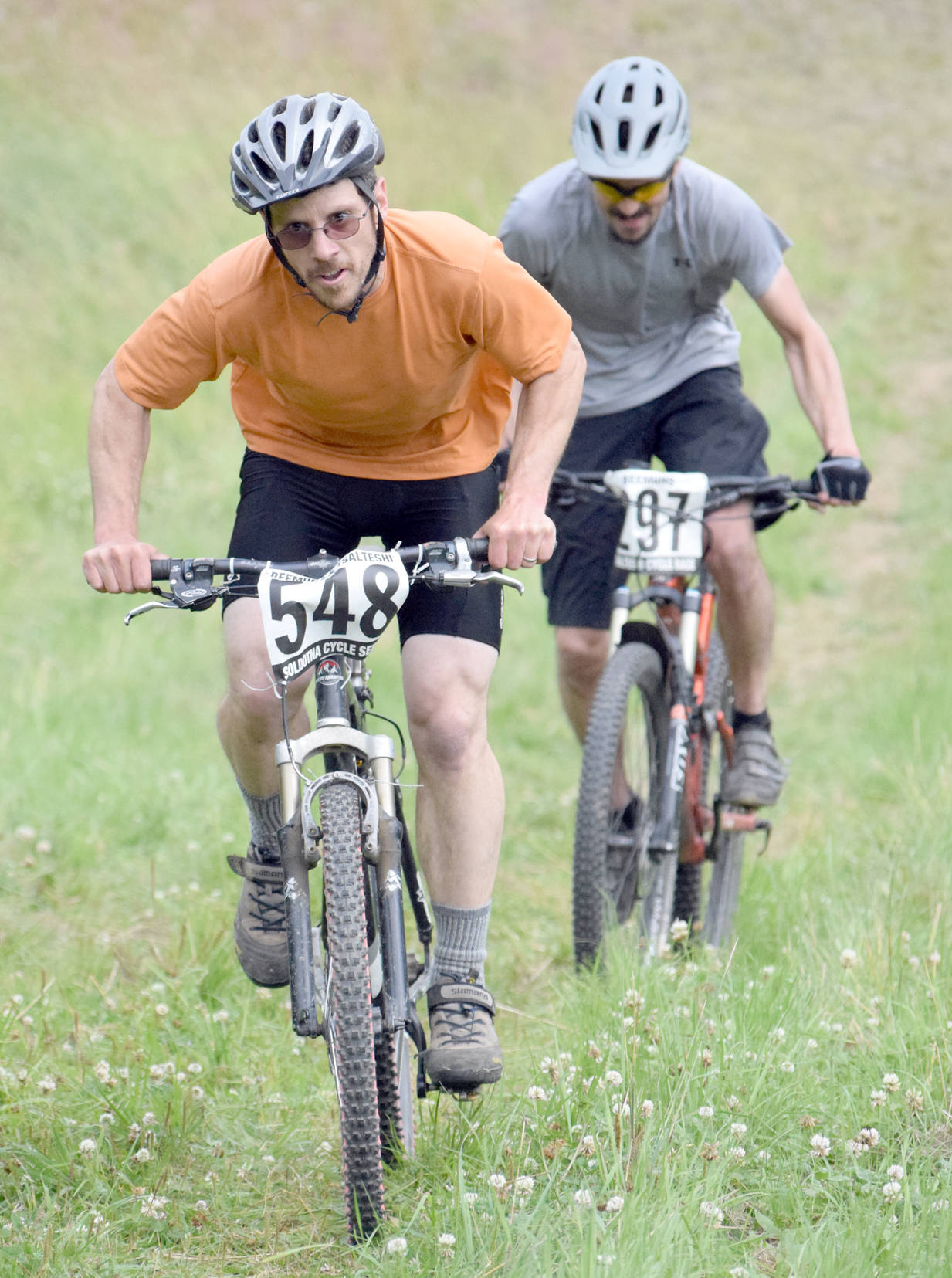 Matthew Dura leads Nathan Kincaid up the final climb in the 10-kilometer Soldotna Cycle Series Race 6, held Thursday, Aug. 3, 2017, at Tsalteshi Trails. Dura would finish fourth, while Kincaid would finish a second behind. (Photo by Jeff Helminiak/Peninsula Clarion)