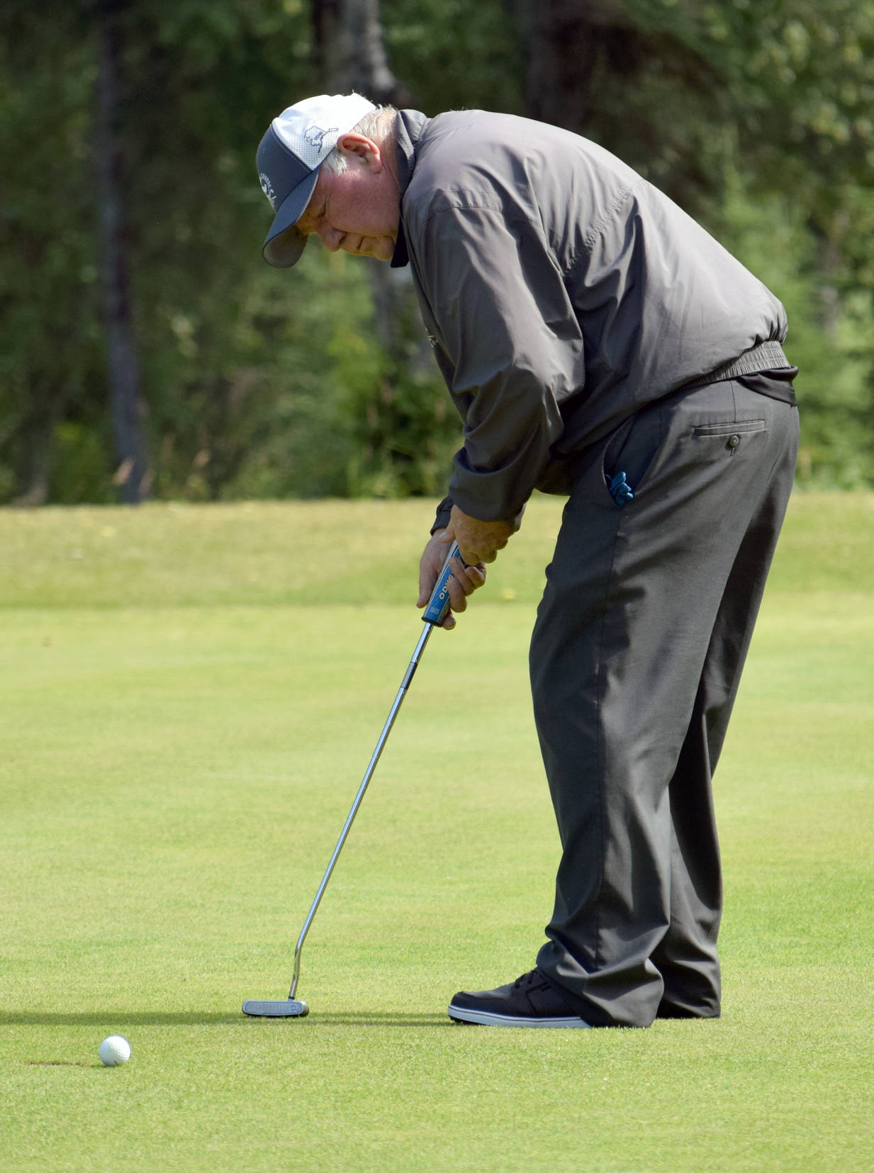 Gordon Griffin putts on the 17th green Sunday, Aug. 13, 2017, at the Donald R. Morgan Memorial Club Championship at Kenai Golf Course in Kenai. (Photo by Jeff Helminiak/Peninsula Clarion)