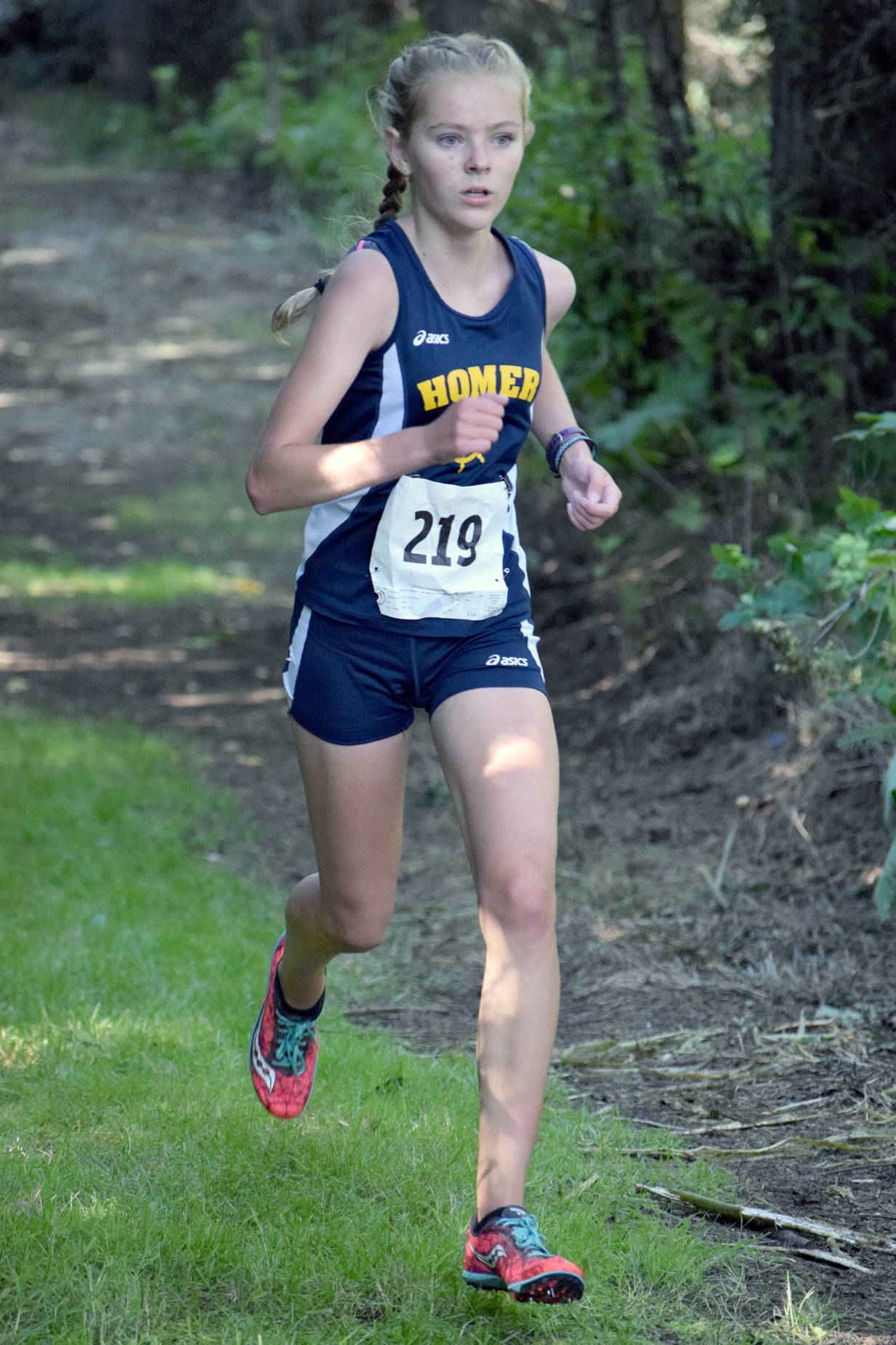 Homer’s Brooke Miller puts the finishing touches on her victory in the freshmen-sophomore girls race Monday, Aug. 14, 2017, at the Nikiski Class Races at Nikiski High School. (Photo by Jeff Helminiak/Peninsula Clarion)