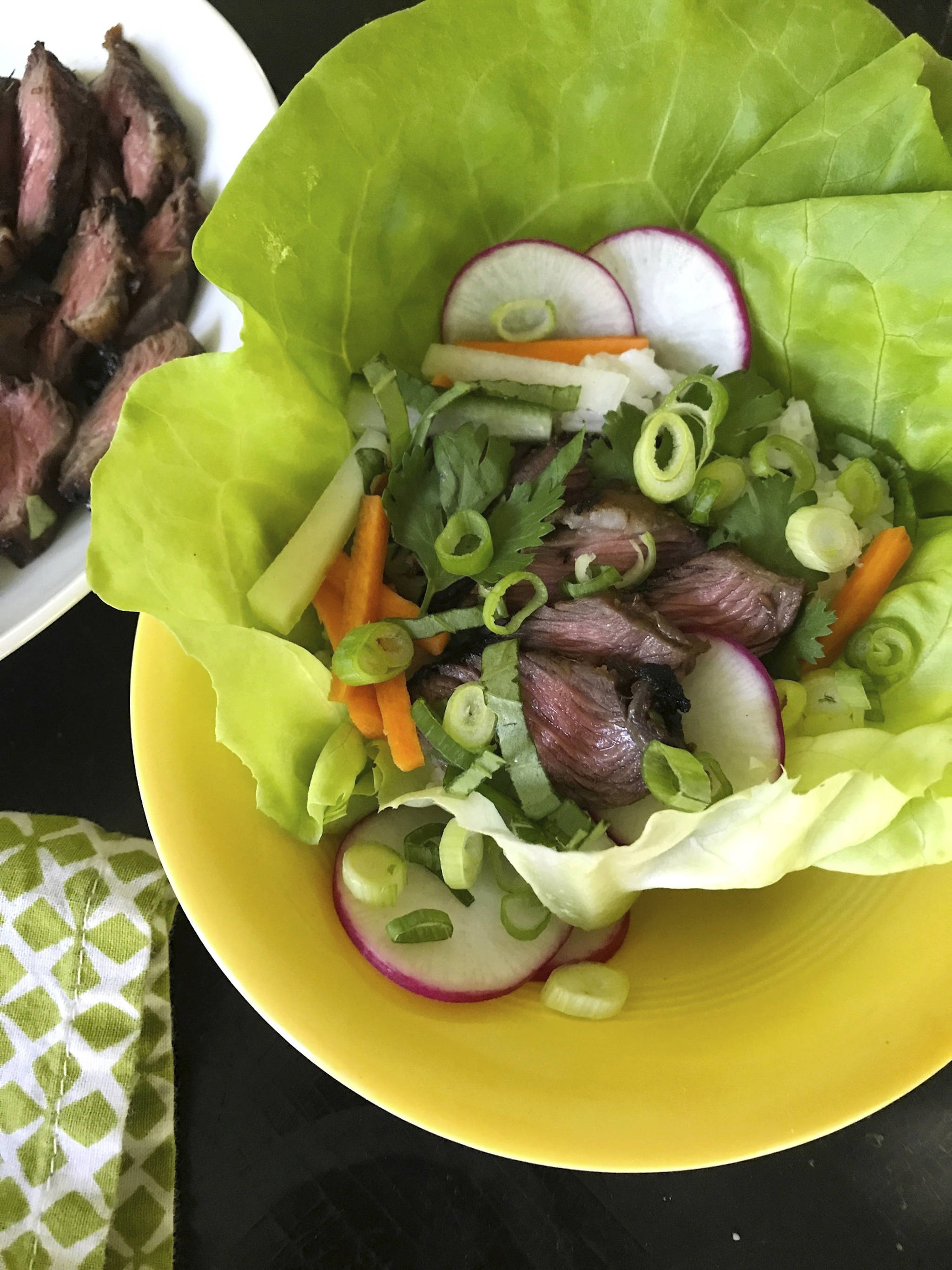 This July photo shows Korean-style grilled short ribs in New York. In general, short ribs have to be cooked either low and slow, or very quickly over high heat so that they don’t become tough. This recipe calls for almost flash grilling, just 3 or 4 minutes on each side. (Katie Workman via AP)