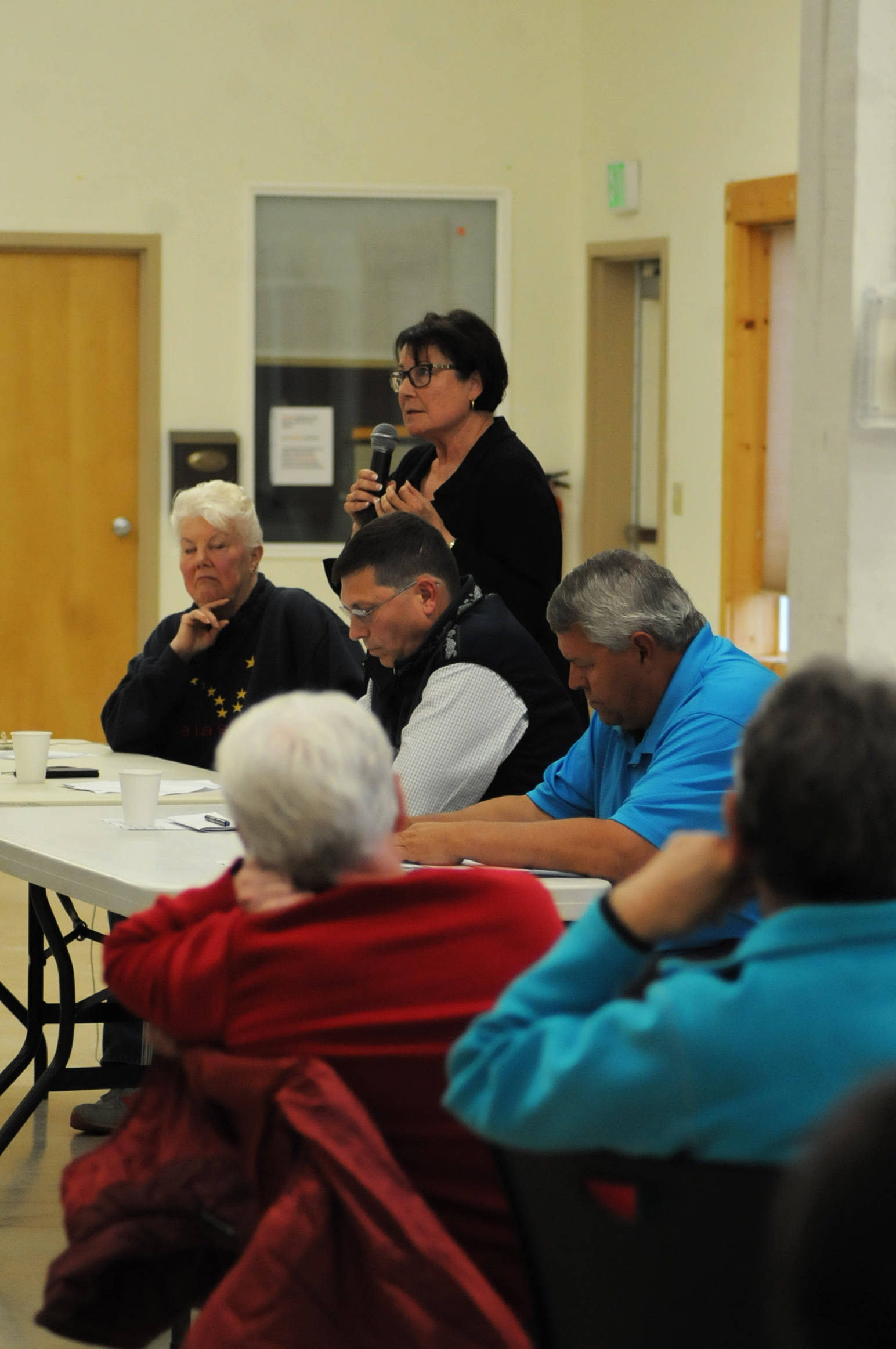 Linda Hutchings (second from left), a candidate for Kenai Peninsula Borough Mayor, answers a question during a forum with fellow candidates Dale Bagley (center) and Charlie Pierce (right) at the Funny River Community Center on Thursday, Aug. 16, 2017 in Funny River, Alaska. (Photo by Elizabeth Earl/Peninsula Clarion)