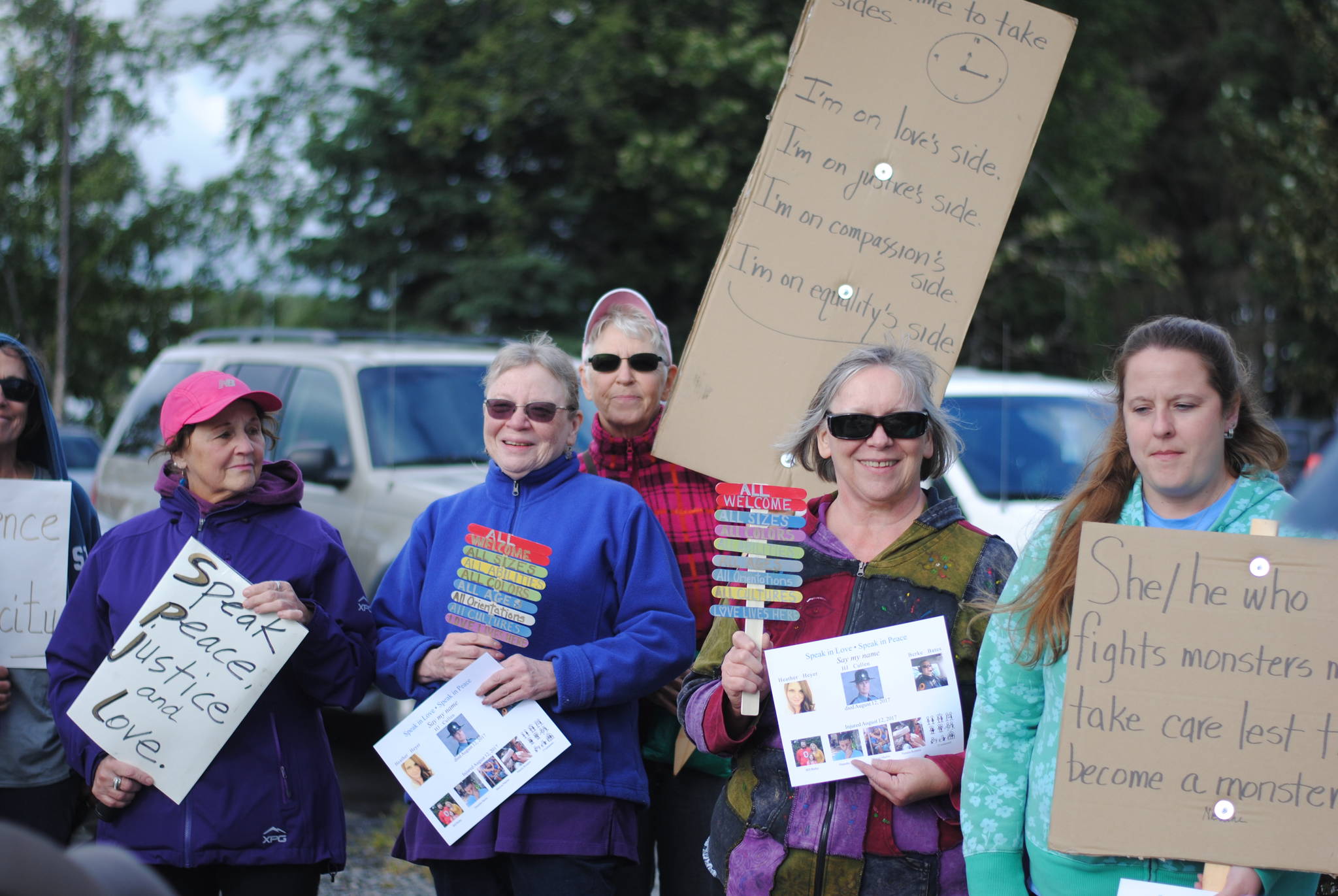 Community members gather in Soldotna Creek Park on Wednesday, August 16 in memorium of Heather Heyer, the woman killed during protests in Charlottesville, Virginia earlier this month. Organizers of the memorial walk have decided to continue the event for the next two weeks. (Photo by Kat Sorensen/Peninsula Clarion)