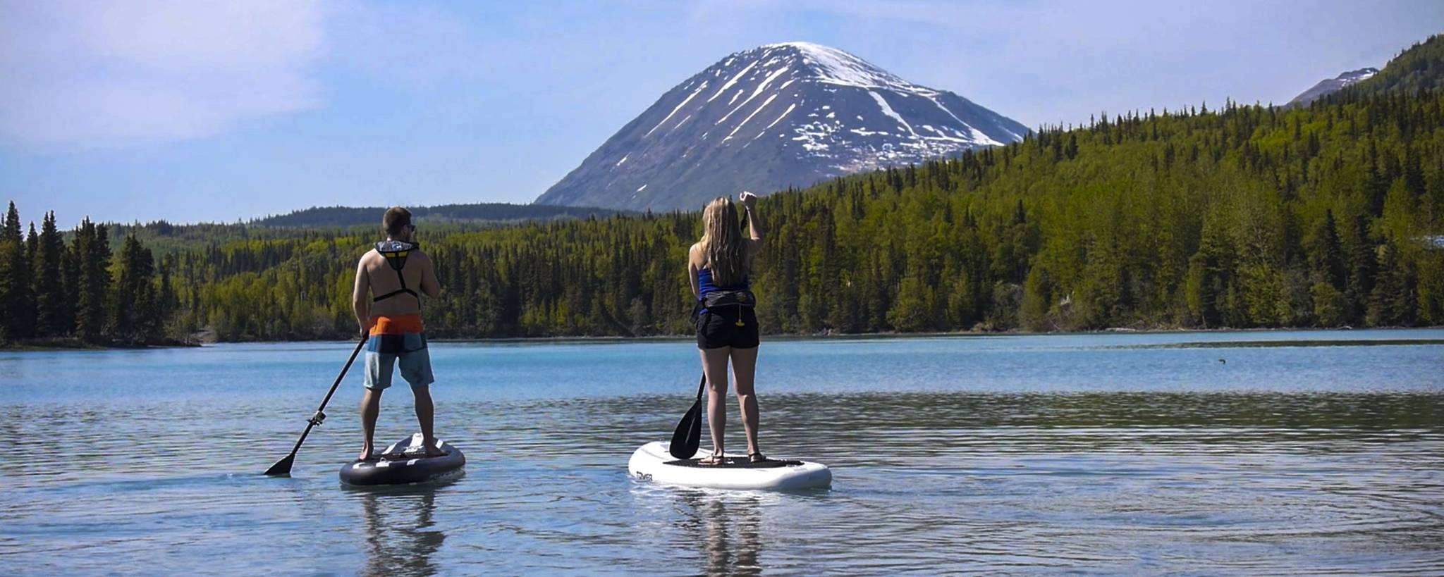 Stand-up paddle boarders explore the waterways of the Kenai Peninsula with Courtney Larsen’s Adventure Guru. (Photo courtesy of Courtney Larsen)