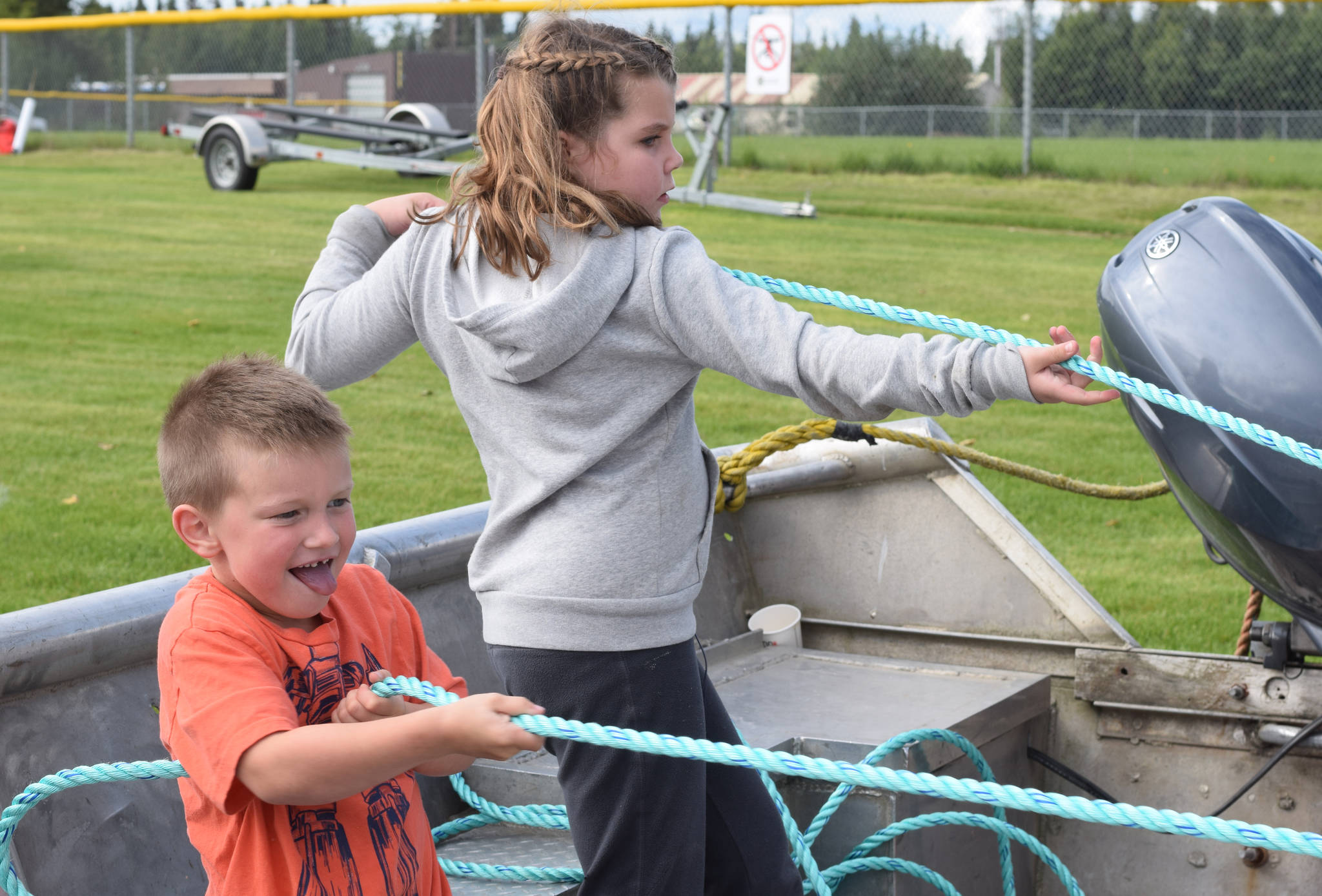 Cody Schaefer, left, and Shayla Smith compete against each other in a net pull at Industry Appreciation Day on Saturday, Aug. 26, 2017 in Kenai, Alaska. (Photo by Kat Sorensen/Peninsula Clarion)
