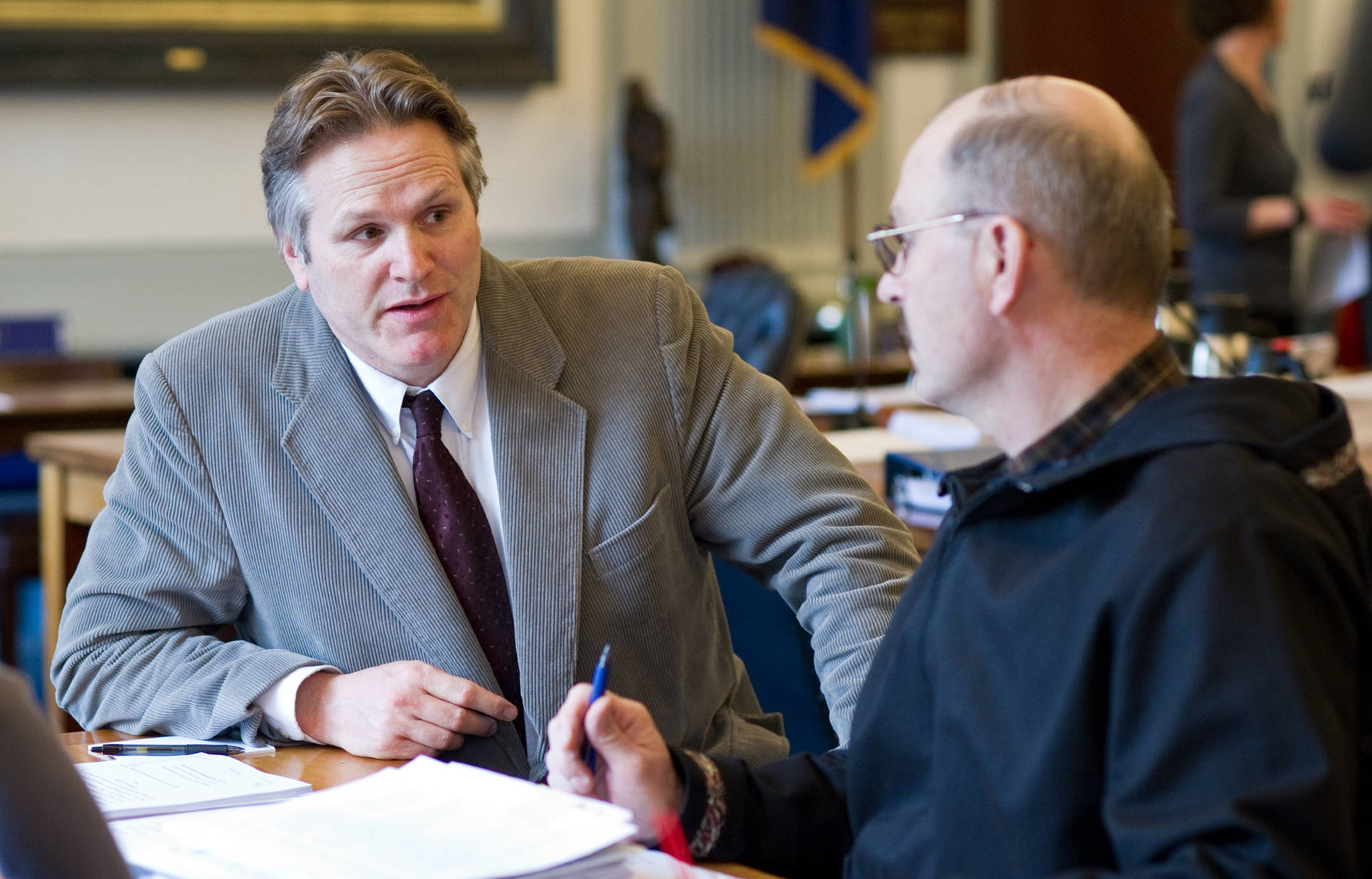 In this April 2014 file photo, Sen. Mike Dunleavy, R-Wasilla, left, speaks with Sen. Click Bishop, R-Fairbanks, before their Senate Finanace Committee meeting at the Capitol. (Michael Penn | Juneau Empire File)