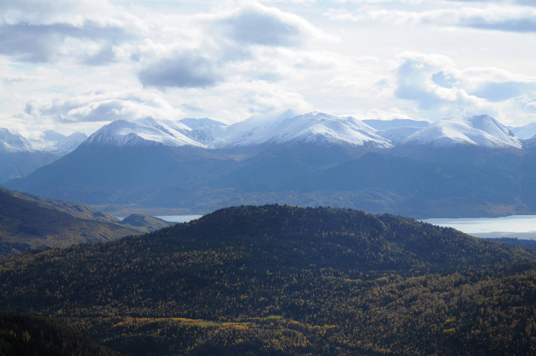 In this September 2016 photo, mountains loom over Skilak Lake and its surrounding hills near Cooper Landing, Alaska. The U.S. Forest Service noted a sharp increase in spruce bark beetle activity in summer 2017 around Southcentral Alaska, including on the Kenai Peninsula, which lost millions of trees to an outbreak of the beetle infestations in the 1990s. (Photo by Elizabeth Earl/Peninsula Clarion)