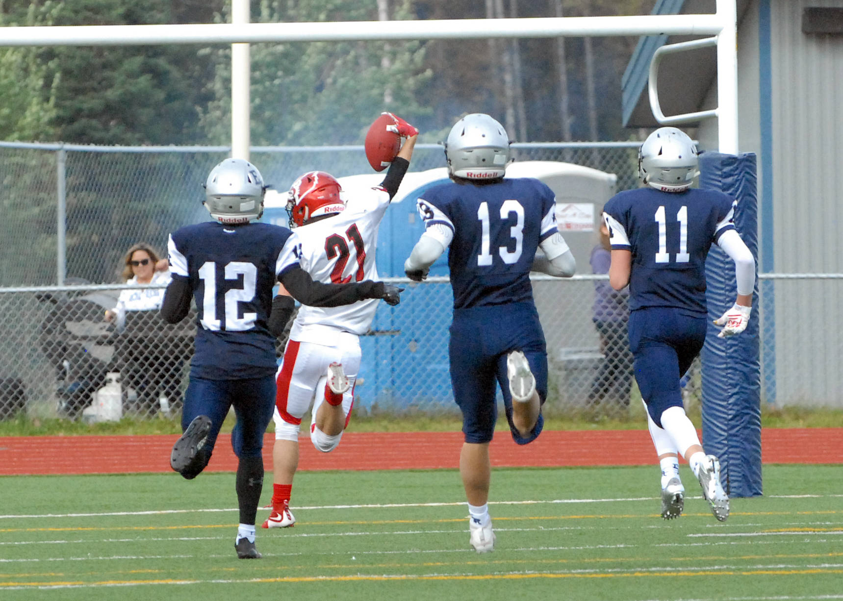 Kenai’s Zack Tuttle celebrates after catching a 71-yard touchdown pass in his team’s 42-28 Northern Lights Conference football win over Eagle River on Saturday, Sept. 2, 2017 at Eagle River High School. (Star photo by Matt Tunseth)