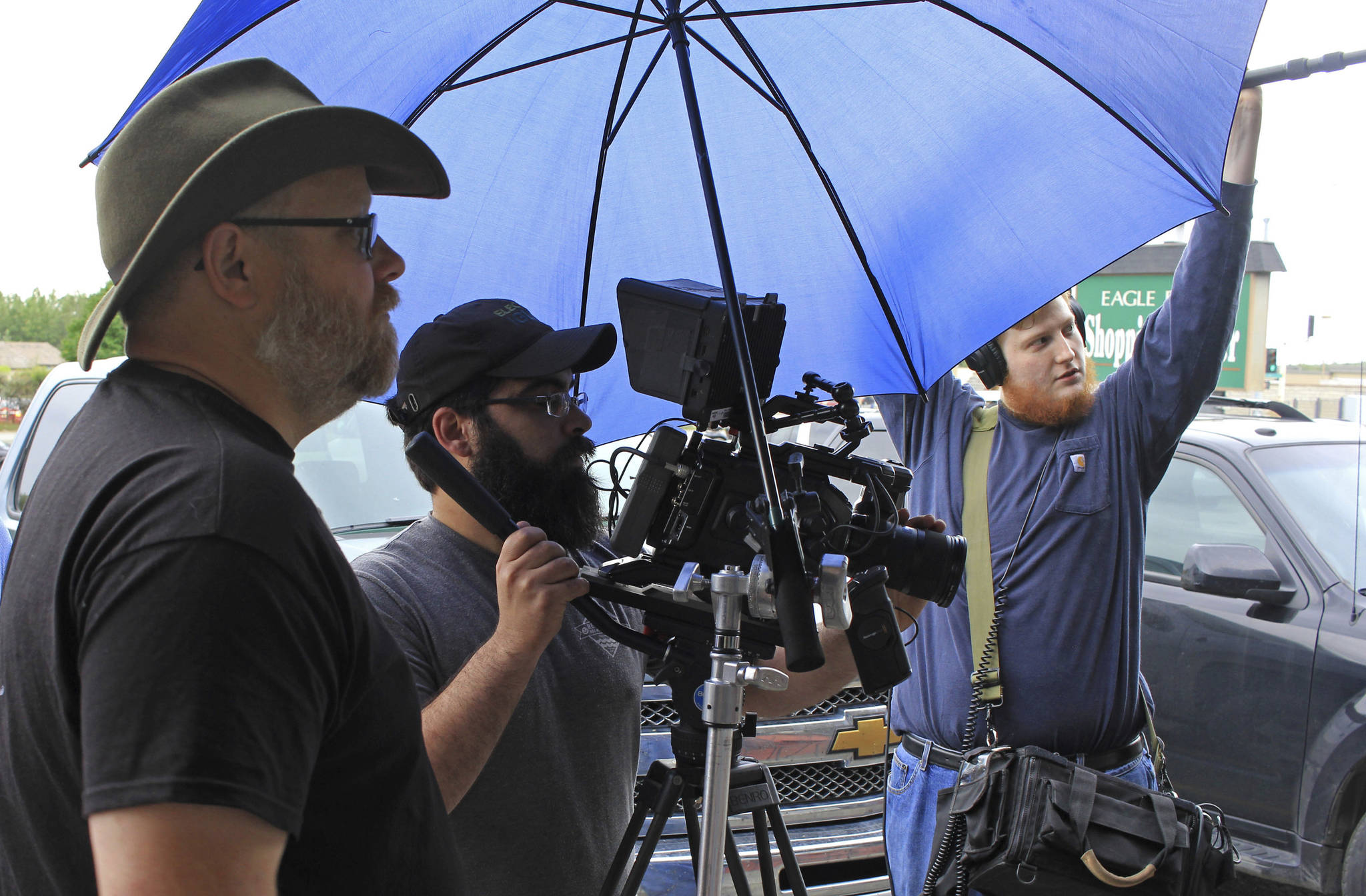 In an Aug. 9 photo, director Charles Baird, left, director of photography Michael Bergstrom, center, and sound man Andrew Wolfe film a scene from “Telltale” in Eagle River, Alaska. The film is one of two independent movies produced by Alaska filmmaker Charles Baird that were filmed in Eagle River the summer of 2017. (Kirsten Swann/Chugiak-Eagle River Star via AP)
