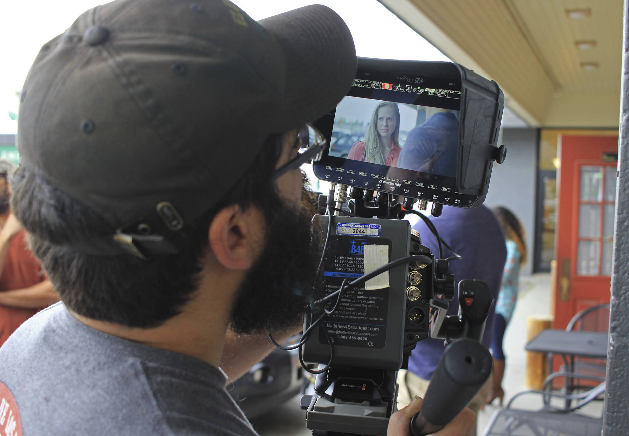 In an Aug. 9, 2017 photo, director of photography Michael Bergstrom films a scene from “Telltale,” featuring actress Carly Jones in Eagle River, Alaska. The film is one of two independent movies produced by Alaska filmmaker Charles Baird that were filmed in Eagle River the summer of 2017. (Kirsten Swann/Chugiak-Eagle River Star via AP)