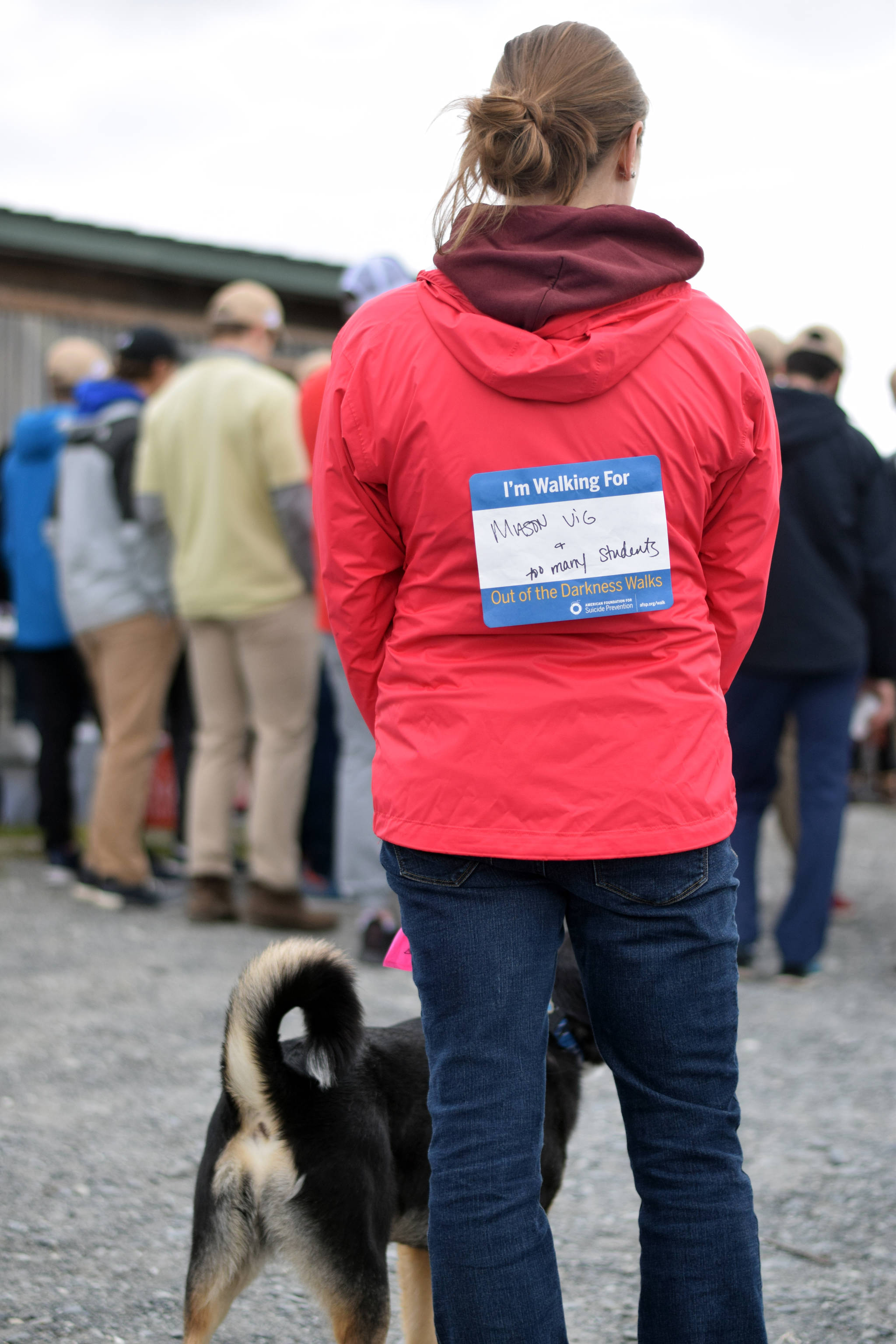 A participant in Sunday’s Out of the Darkness Kenai Walk adorned a bib saying who she was walking for — Mason Vig and too many students. The walk started at the Kenaitze Fishery Site in Kenai, Alaska and continued down the beach for one mile. (Photo by Kat Sorensen/Peninsula Clarion)