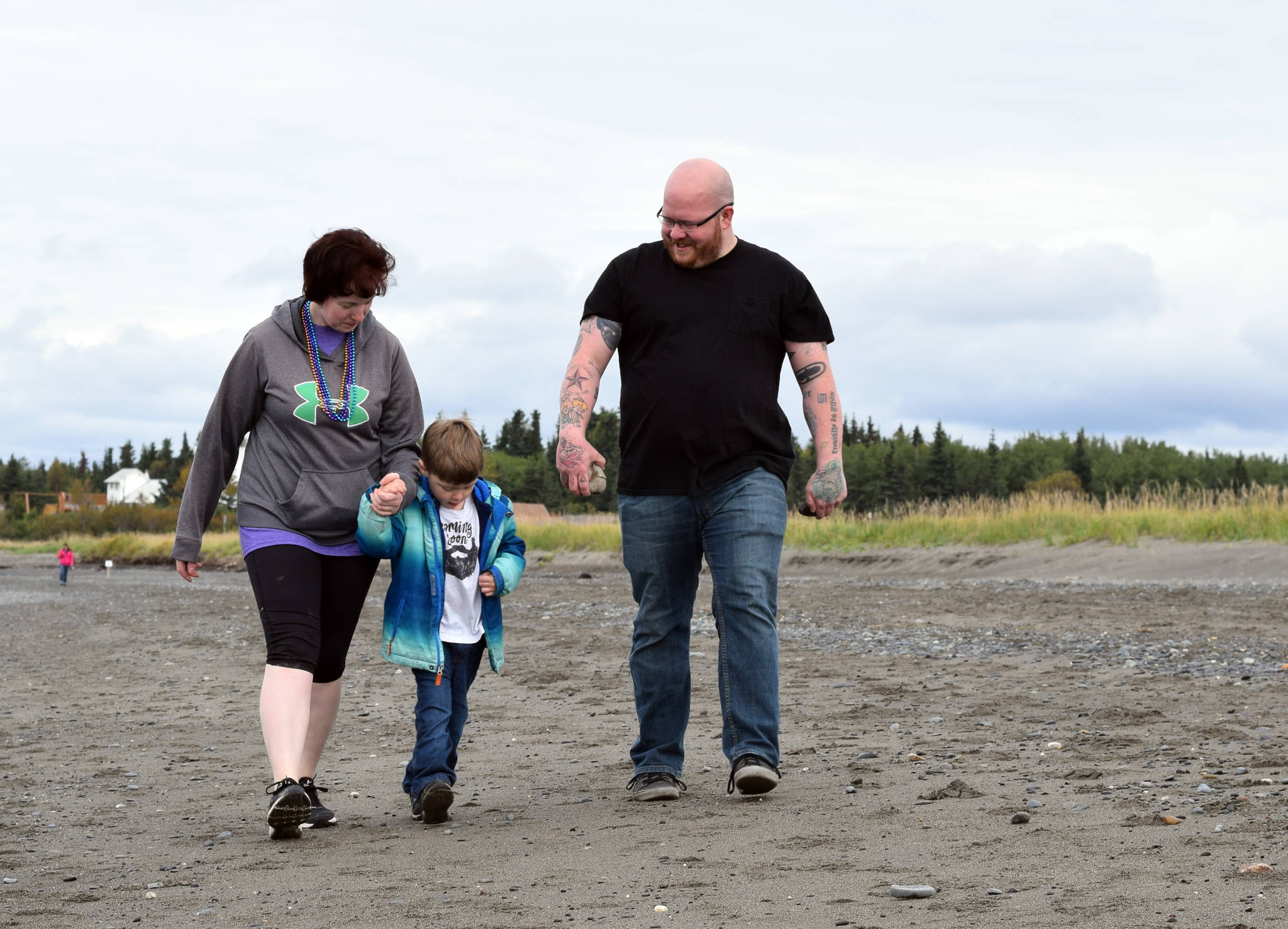 Chelsey Carter, from left, Charlie Rowe Killian and Derek Killian participated in Sunday’s Out of the Darkness Kenai Walk at the Kenaitze Fishery Site in Kenai, Alaska on Sept. 10. (Photo by Kat Sorensen/Peninsula Clarion)