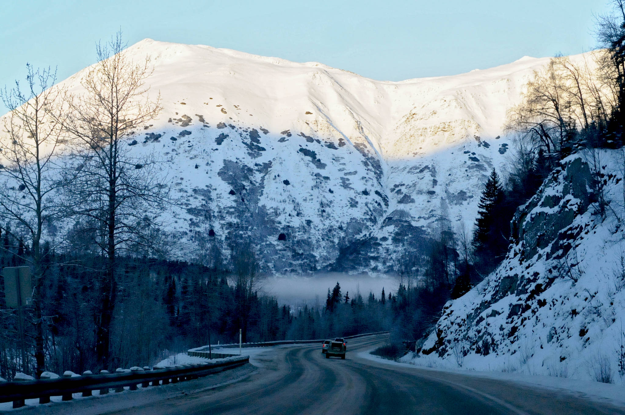 In this December 2016 photo, cars wend their way northward along the Seward Highway near Hope, Alaska. In response to difficulties with emergency response during accidents on the highway corridor, the Kenai Peninsula Borough is working on the logistics for a service area specifically to provide emergency services to the approximately 113 miles of highway in the borough east of Cooper Landing. (Clarion file photo)