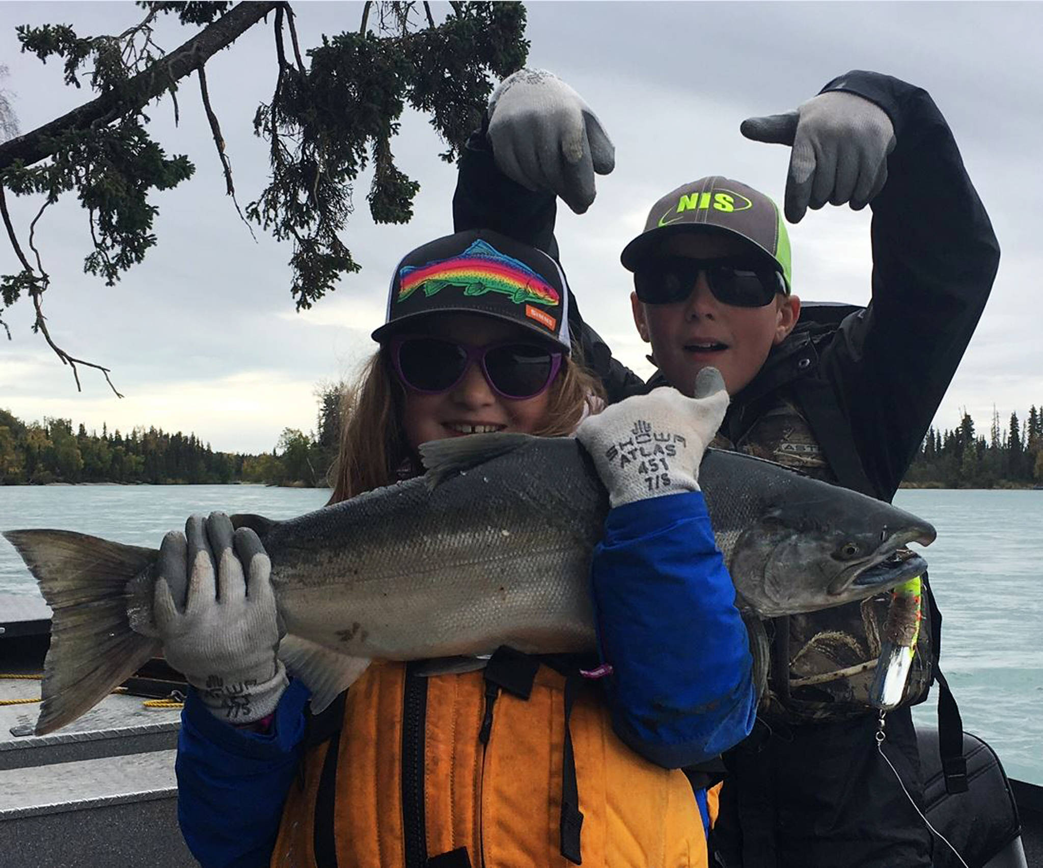 Lily Craig (left) and Joseph Craig show off the silver salmon they caught on the Kenai River during the Kenai Chamber of Commerce’s first annual silver salmon derby in September 2017. (Photo courtesy Nathaniel Craig)