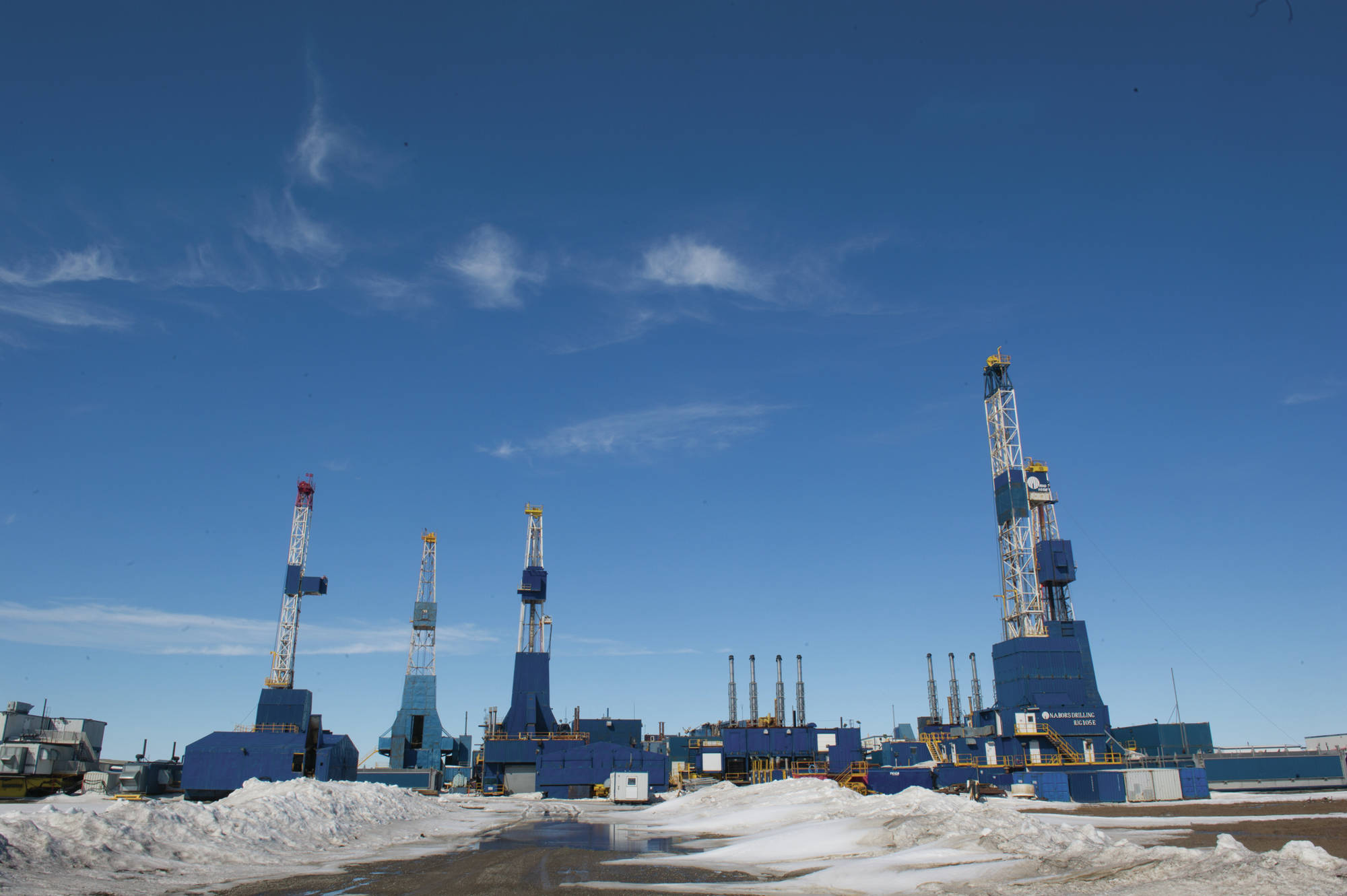 Nabors drilling rigs sit idle at Prudhoe Bay in this May 25 photo. State regulators are working to finalize the method for assessing oil and gas properties for tax value that they have been using for the past several years. The new regulations apply to all oil and gas properties other than the Trans-Alaska Pipeline System. (Photo/Michael Dinneen/For the Journal)