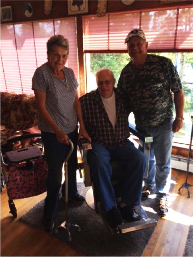 Dale Prechel of Minnesota poses for a picture with Ruth and Bob Knorr of Funny River in this undated photograph. The Knorrs helped Prechel when he showed up on their porch after falling off the bluff in the middle of the night in July 2014. (Photo courtesy Jackie Prechel)