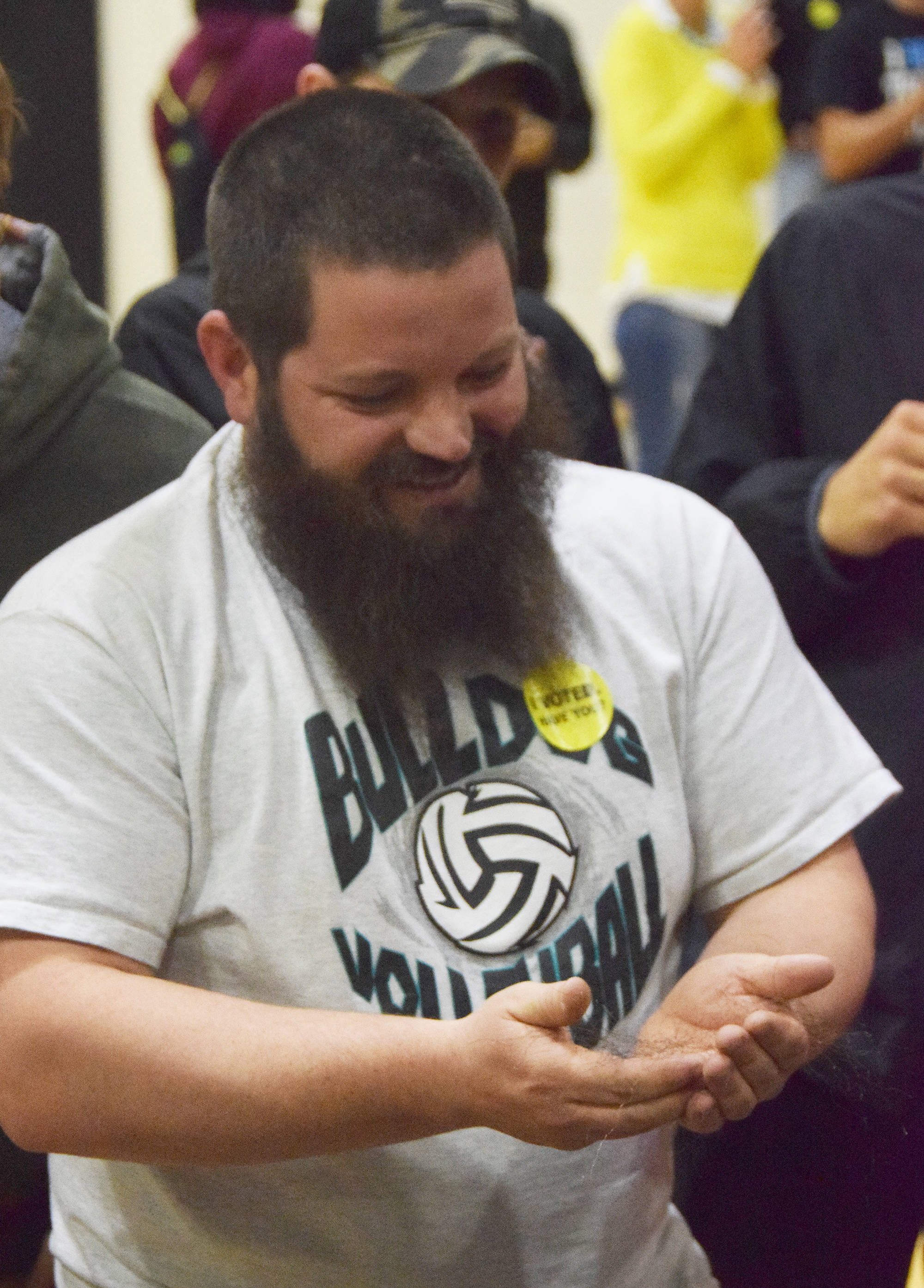 NIkiski High School athletic director Dylan Hooper holds strands of beard hair in his hands following a world record attempt at the heaviest weight held by a beard Tuesday at Nikiski High School. Hooper succeeded in breaking the previous record of 140 pounds by lifting 145.9 pounds, the weight of Nikiski junior Justin Cox. (Photo by Joey Klecka/Peninsula Clarion)