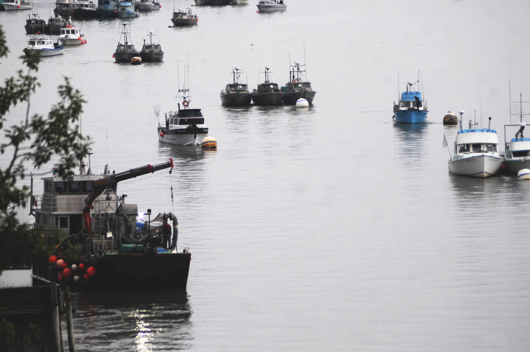 Commercial fishing vessels wait at anchor in the mouth of the Kenai River before a Saturday fishing period Friday, July 28, 2017 in Kenai, Alaska. (Photo by Elizabeth Earl/Peninsula Clarion)