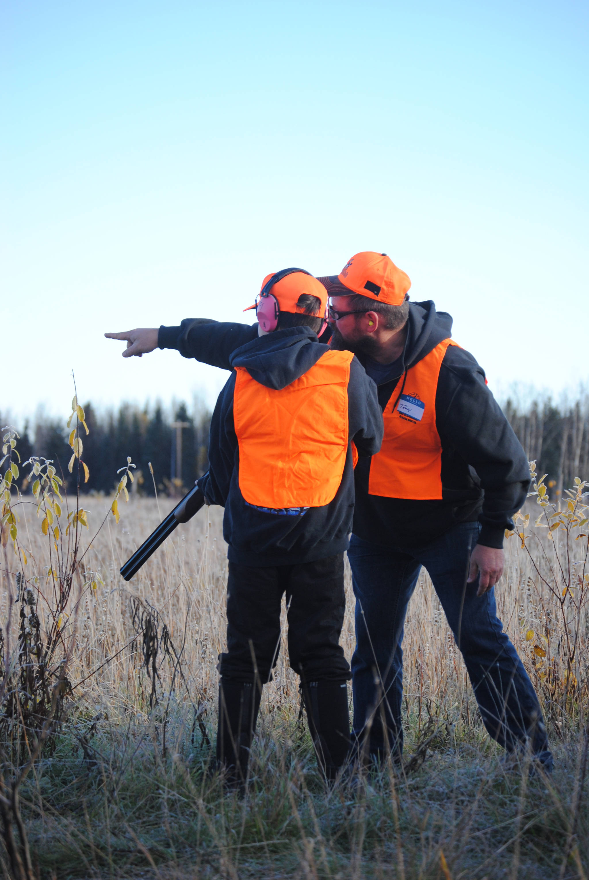 Safari Club International volunteers work closely with participants throughout the day in Funny River, Alaska on Saturday, October 9, 2017 to ensure safety and an understanding of the basics of shooting and hunting. (Photo by Kat Sorensen/Peninsula Clarion)