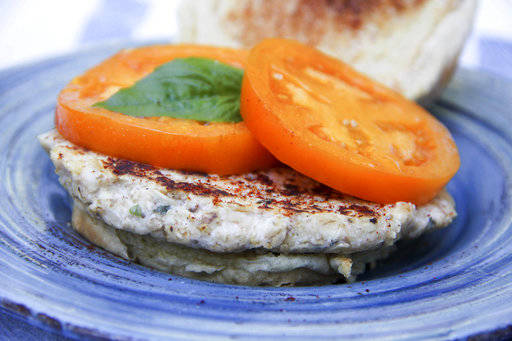 This Oct. 2 photo shows a meatless cheesy oat burger in Bethesda, Md. Part-skim ricotta cheese is the star of a tasty meatless burger patty that looks almost like a turkey burger, but tastes more like an Italian-inspired fried cheese appetizer. (Melissa D’Arabian via AP)