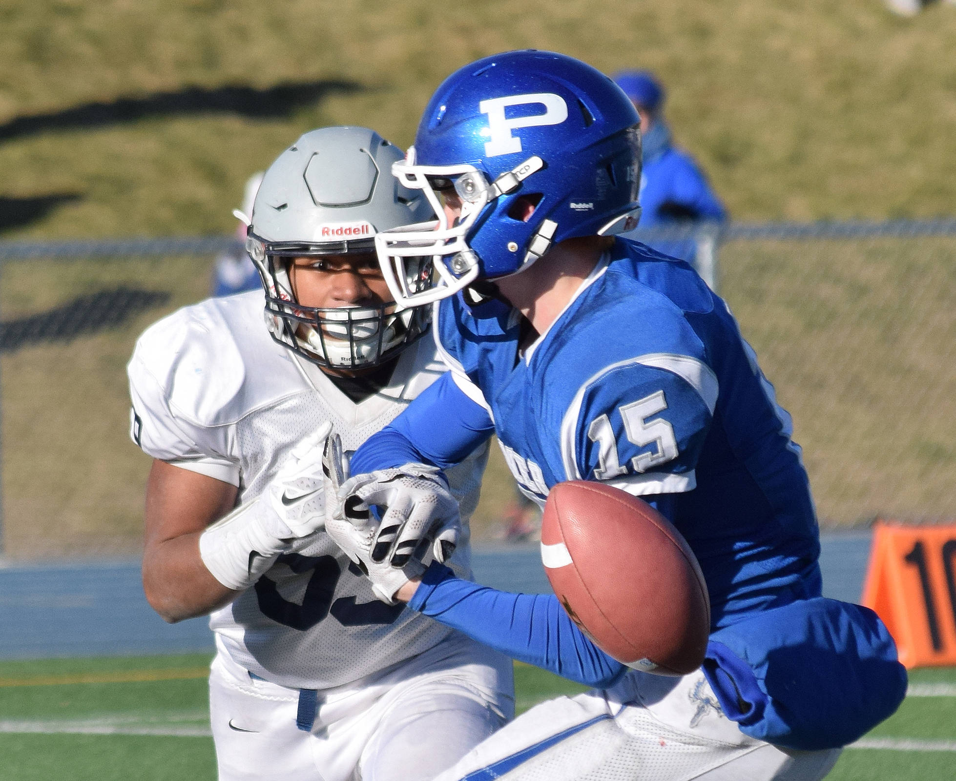 Soldotna linebacker Wendell Tuisaula eyes Palmer reciever Skyler Hale (15) in the second half of the 2016 medium-schools state football championship in October 2016 at Palmer High School. (Photo by Joey Klecka/Peninsula Clarion)