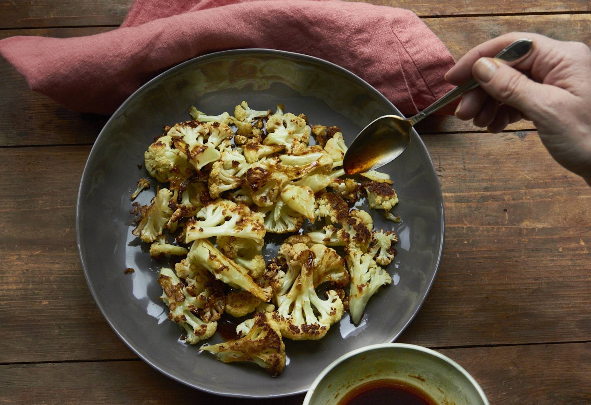 This Jan. 27 photo shows roasted cauliflower with a sesame drizzle in New York. This dish is from a recipe by Katie Workman. (Mia via AP)