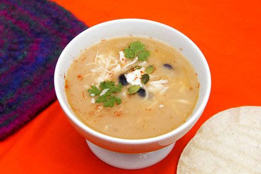 This Oct. 4 photo shows a bowl of ten-minute tortilla soup in Bethesda, Md. This dish is from a recipe by Melissa d’Arabian. (Melissa d’Arabian via AP)