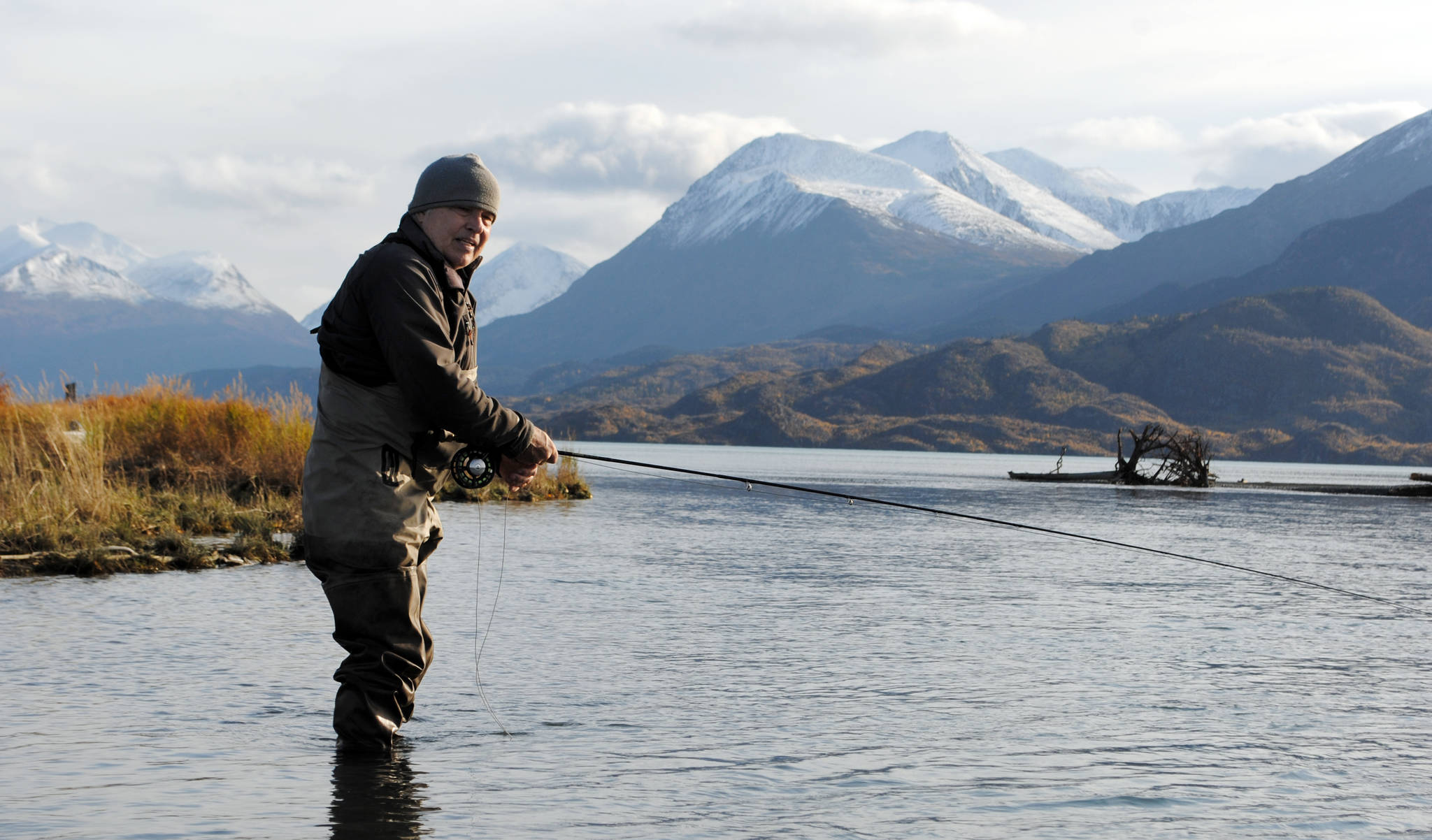 Mike Tuhy, owner and operator of the Tower Rock Lodge in Kenai, Alaska, casts for trout in the Upper River Kenai on Oct. 11, 2017. (Photo by Kat Sorensen/Peninsula Clarion)