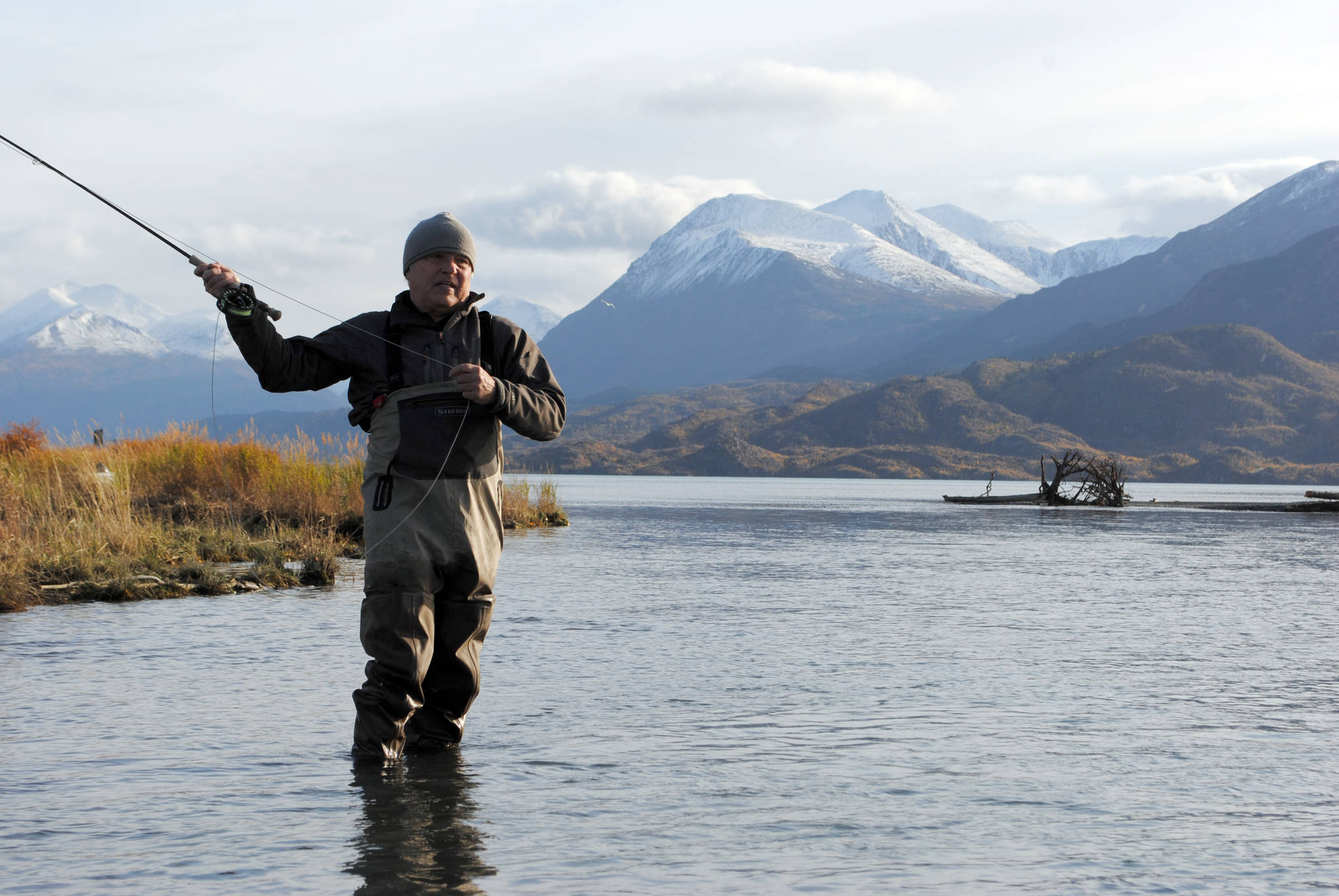 Mike Tuhy, owner and operator of the Tower Rock Lodge in Kenai, Alaska, casts for trout in the Upper River Kenai on Oct. 11, 2017. (Photo by Kat Sorensen/Peninsula Clarion)