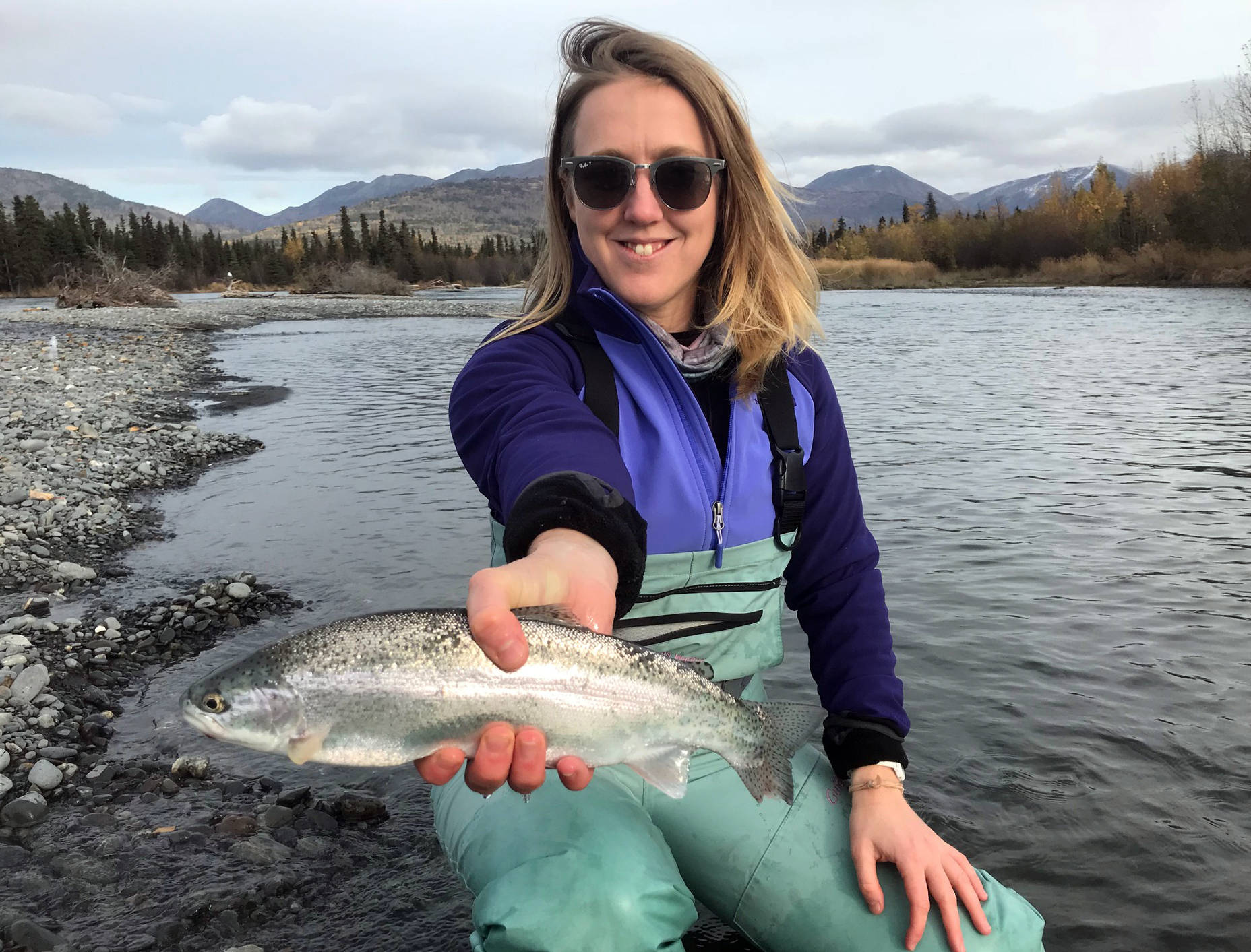 Novice fly angler and writer of this story holds out a rainbow trout she managed to catch on her first fly fishing trip with Michael Tuhy and Brant Koetting of Tower Rock Lodge in the Upper River Kenai in Alaska on Oct. 11. (Photo by Kat Sorensen/Peninsula Clarion) Novice fly angler and writer of this story holds out a rainbow trout she managed to catch on her first fly fishing trip with Michael Tuhy and Brant Koetting of Tower Rock Lodge in the Upper River Kenai in Alaska on Oct. 11, 2017. (Photo by Kat Sorensen/Peninsula Clarion)