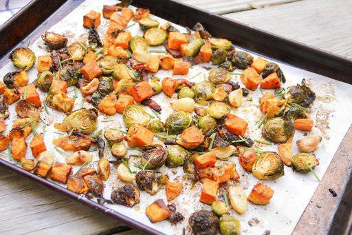 This Oct. 16 photo shows roasted sweet potato and Brussels sprouts hash in Bethesda, Md. This dish is from a recipe by Melissa d’Arabian. (Melissa d’Arabian via AP)