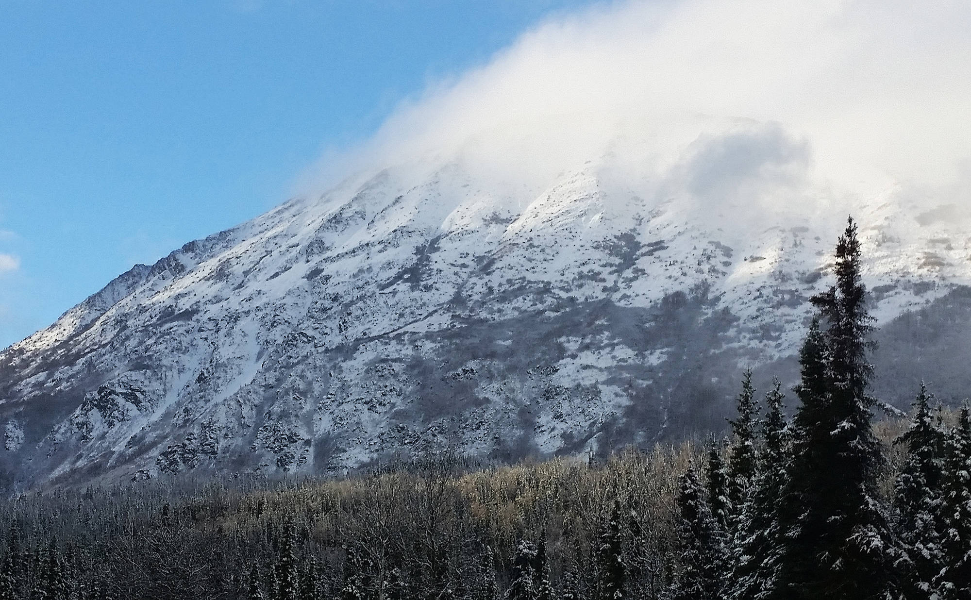 Clouds roll over a mountain near Cooper Landing on Monday, Oct. 23, 2017. (Photo by Joey Klecka/Peninsula Clarion)