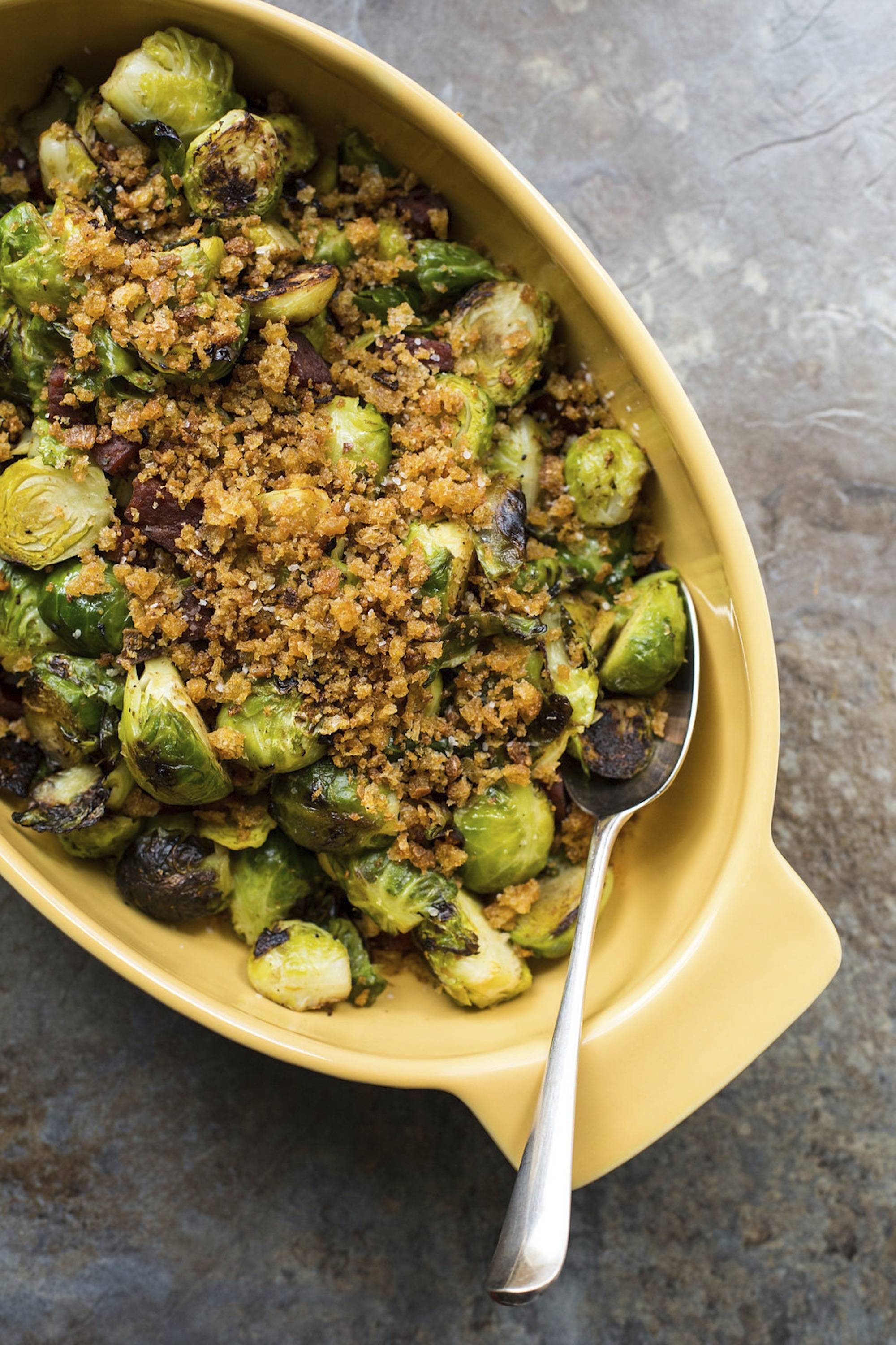 This Feb. 13 photo shows pan-roasted Brussels sprouts with chorizo and toasted bread crumbs. This dish is from a recipe by Katie Workman. (Sarah Crowder via AP)