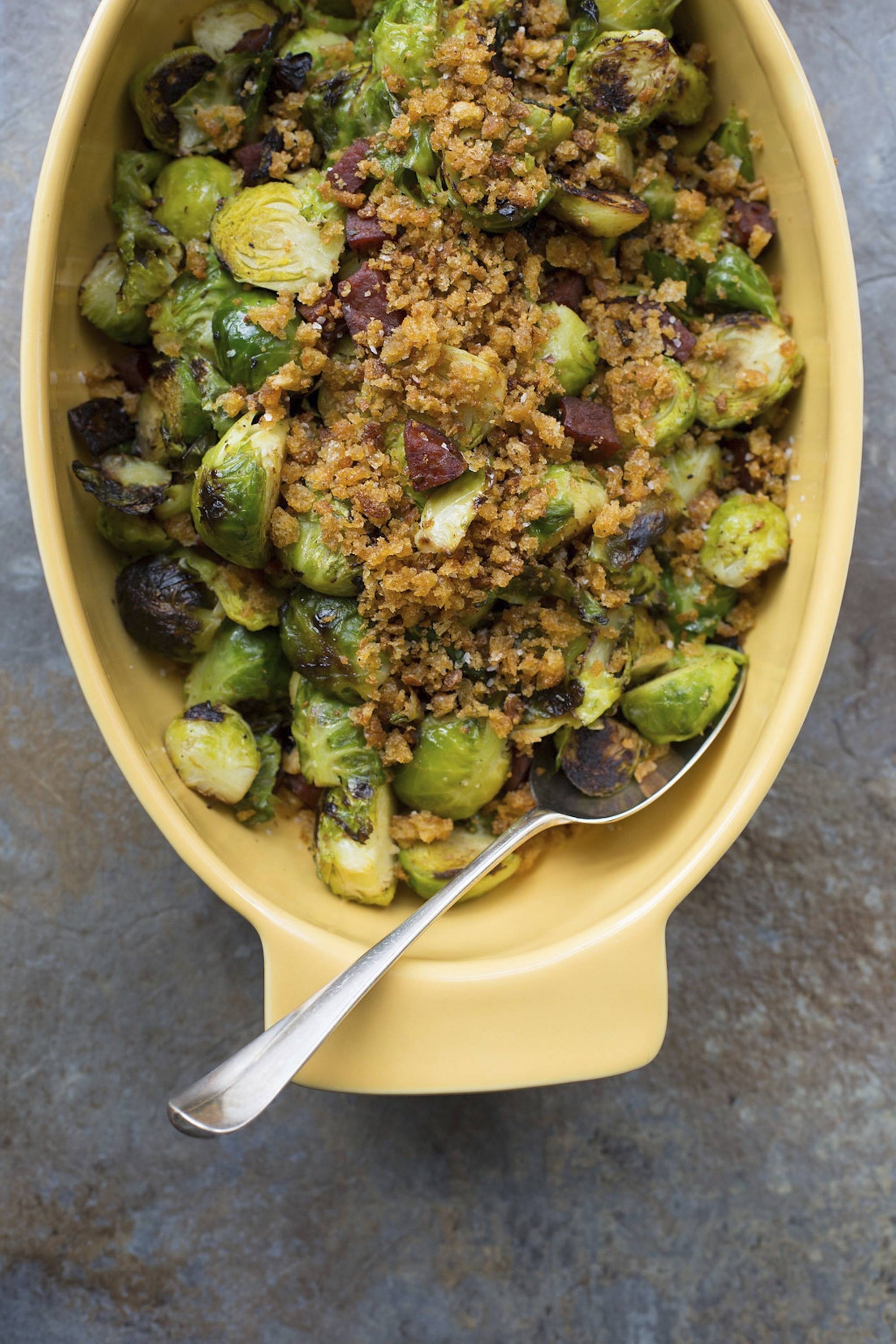 This Feb. 13 photo shows pan-roasted Brussels sprouts with chorizo and toasted bread crumbs. This dish is from a recipe by Katie Workman. (Sarah Crowder via AP)