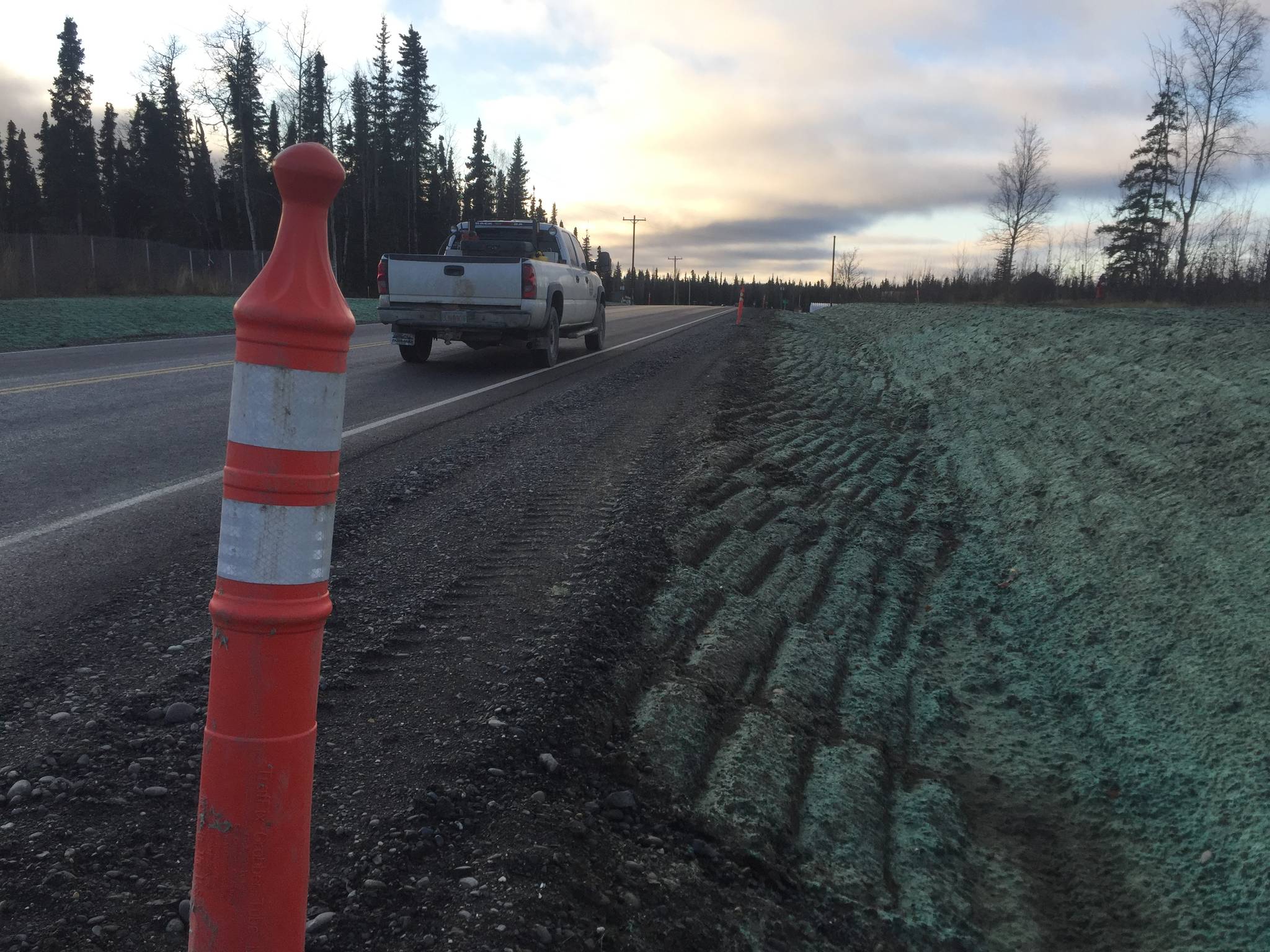 A truck drives down Funny River Road near the Soldotna Municipal Airport on Tuesday, Oct. 31, 2017 in Soldotna, Alaska. Construction crews finished working on preliminary work to widen the shoulders and improve ditching and signage along Funny River Road this week before packing up for the winter, to be continued in summer 2018. (Photo by Elizabeth Earl/Peninsula Clarion)