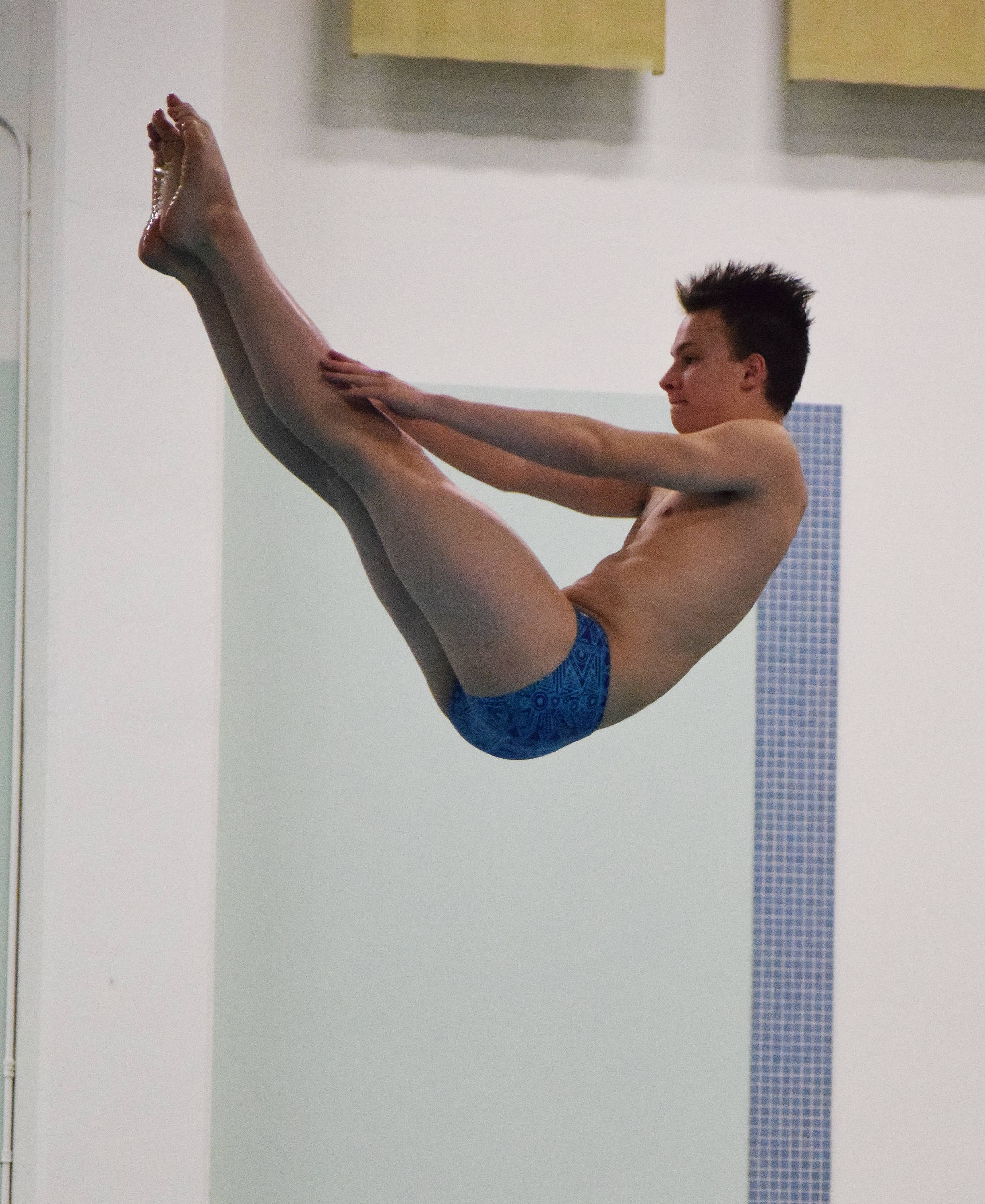 Soldotna’s Kylin Welch pulls off a move in the boys 1-meter diving event Saturday at the ASAA First National Bank State Swimming & Diving Championships at the Bartlett High pool. (Photo by Joey Klecka/Peninsula Clarion)